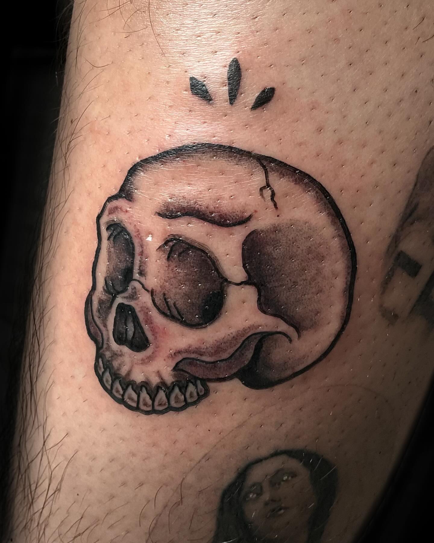Skull black and grey tattoo on the forearm by J. Arturo Laparra