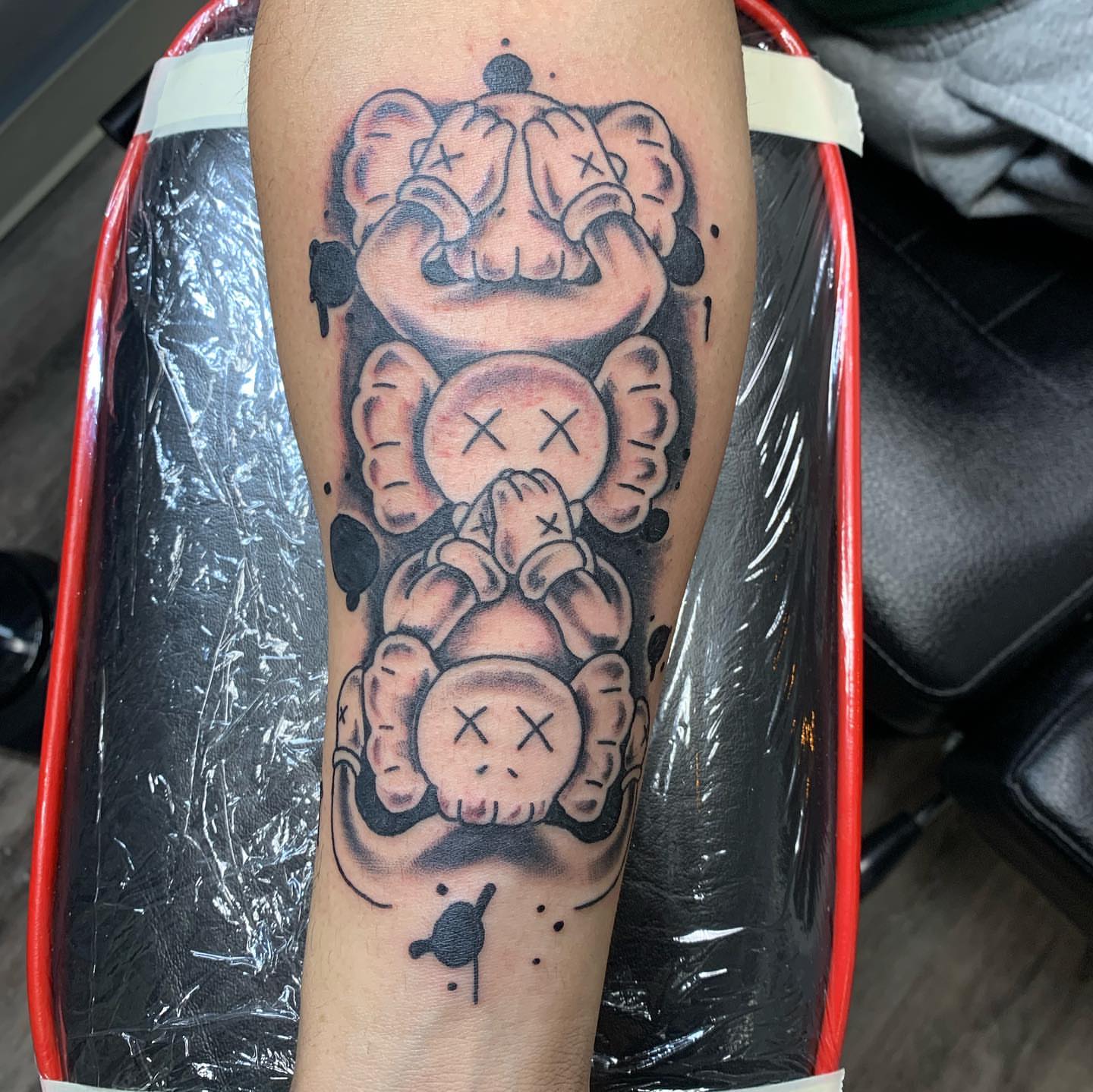 Stuffed animal black and grey tattoo on the forearm by @goat76