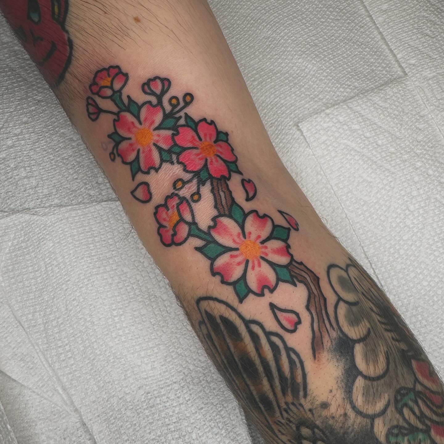 Cherry blossoms American traditional tattoo on the forearm by Liz Mercer ★ Tattooer - Raleigh NC