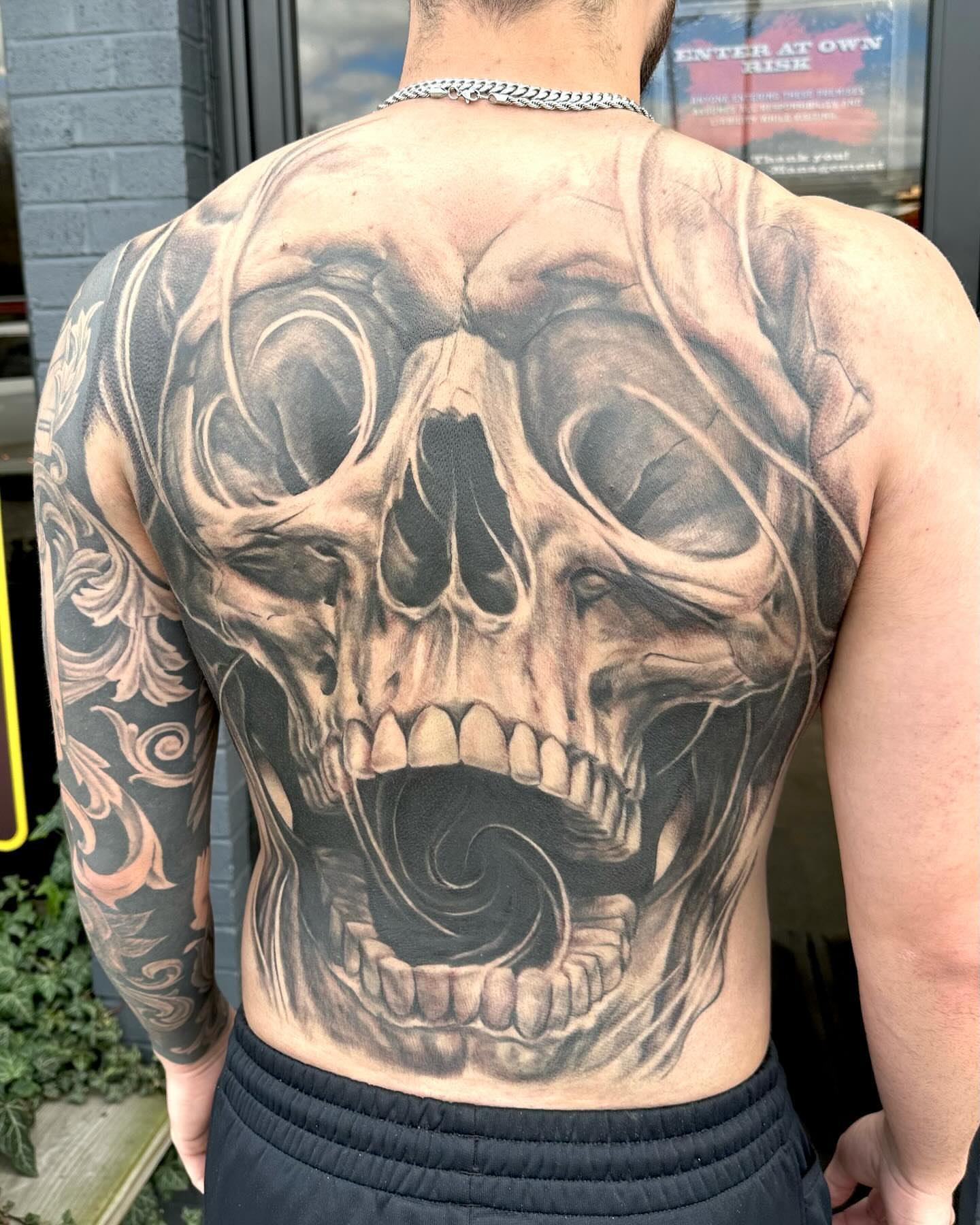 Skull realism tattoo on the back by Comfy Chris Fettig