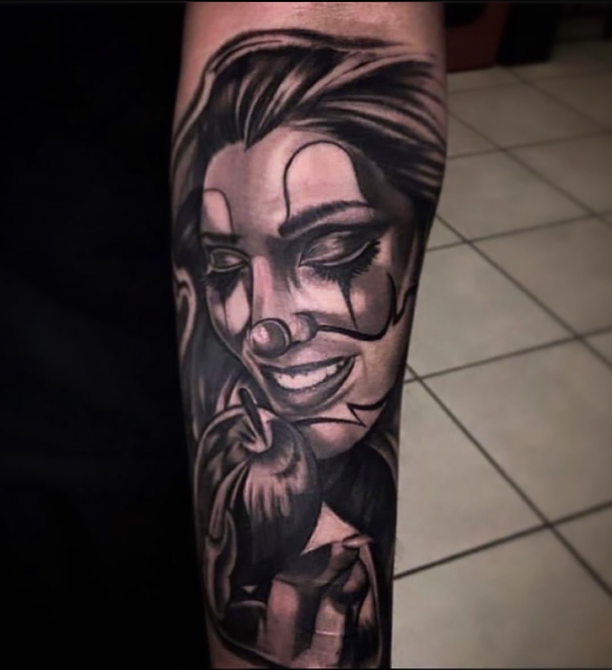 Clown realism tattoo on the forearm by ♟️SouthEastLA♟️