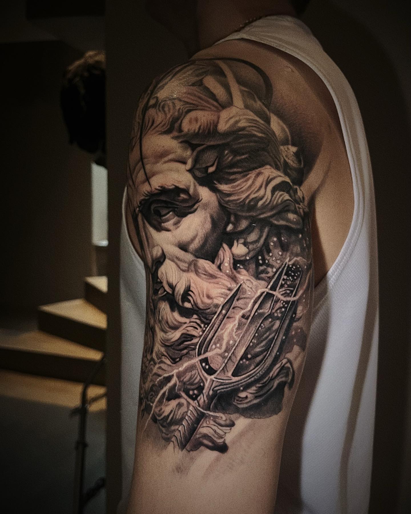 God-like figure realism tattoo on the upper arm by Duo