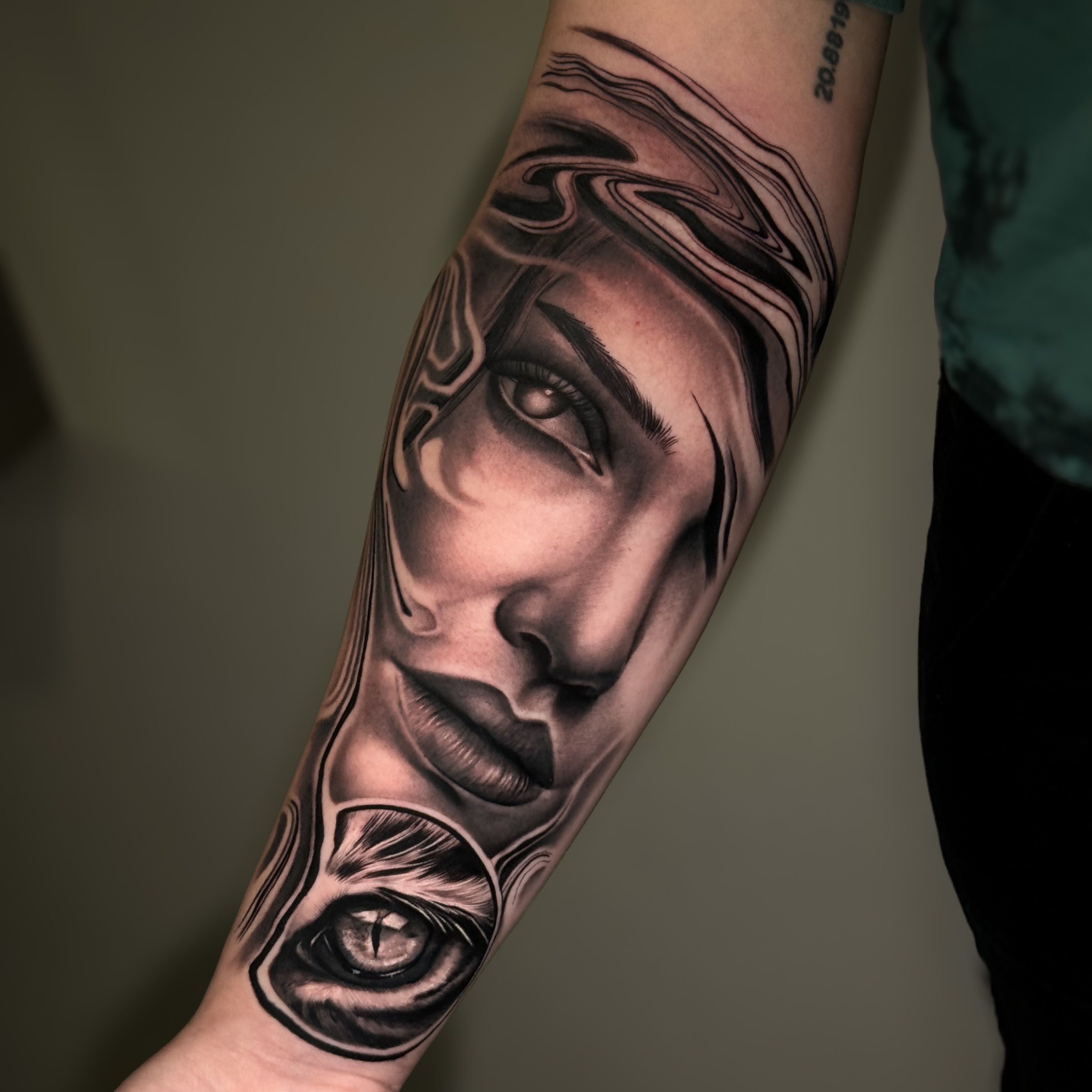Woman's face realism tattoo on the forearm by Flamure Islami