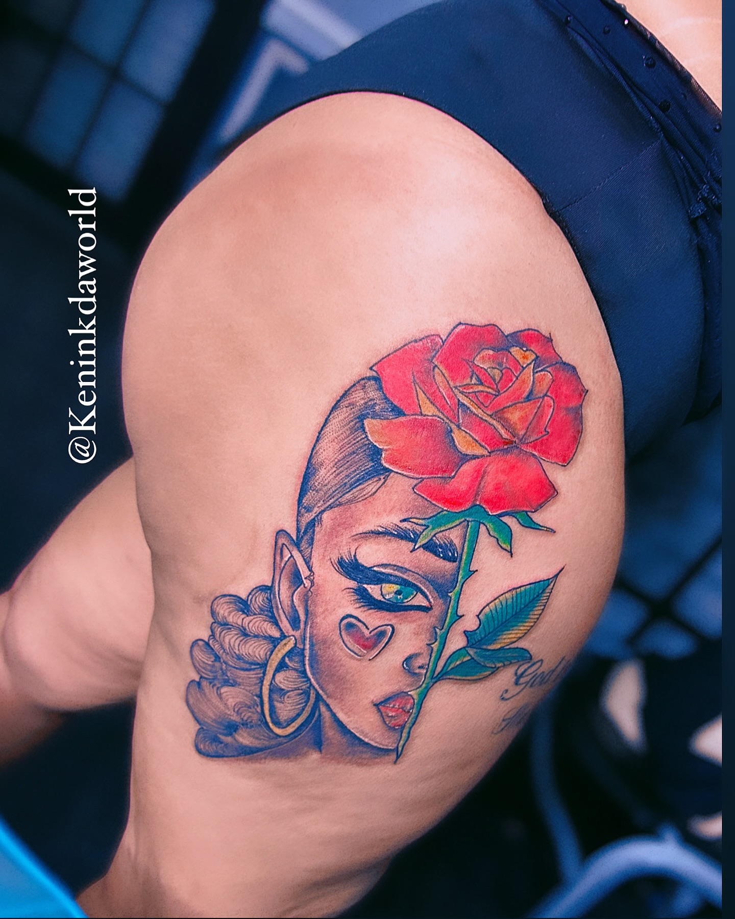 Woman with rose American traditional tattoo on the shoulder by Ken West