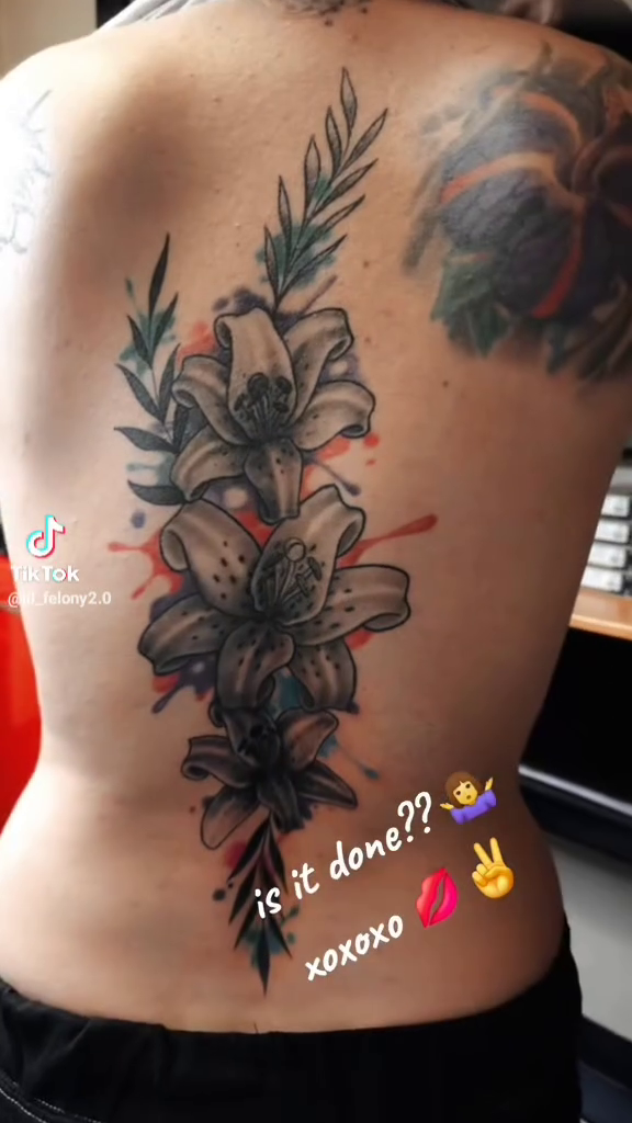 Floral arrangement realism tattoo by Germaine Sherman