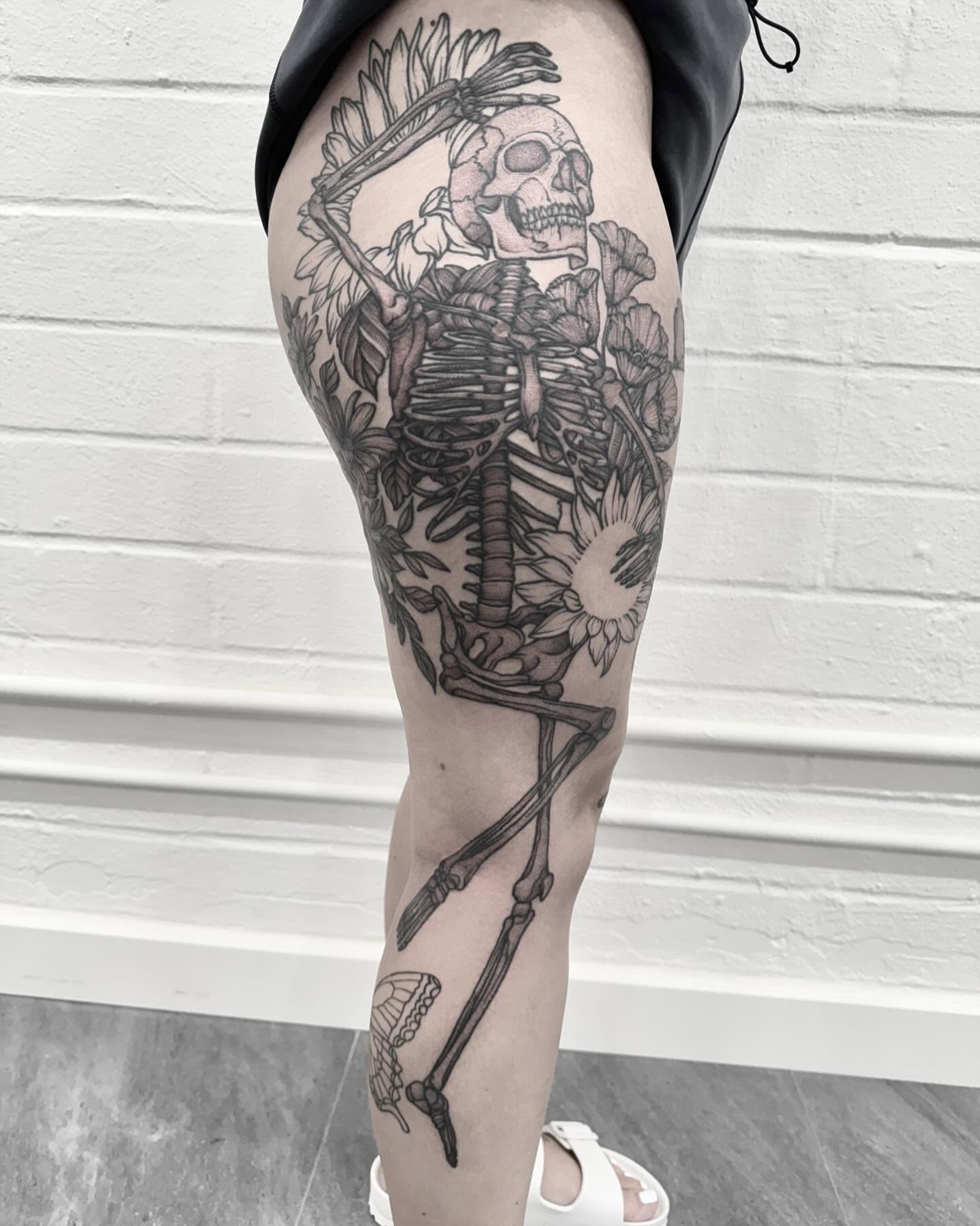 Skeleton with flowers realism tattoo on the thigh by Alex Shakuto Tattoo
