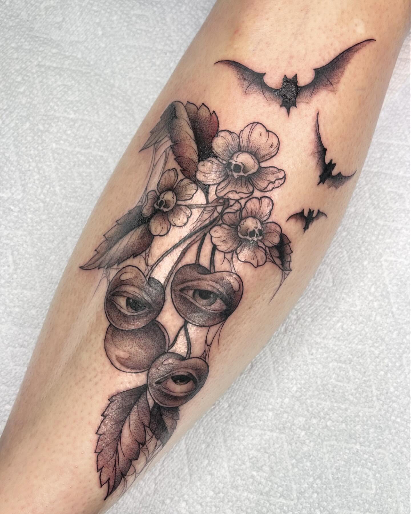 Cherry blossom bats realism tattoo on the forearm by Lexx Christine