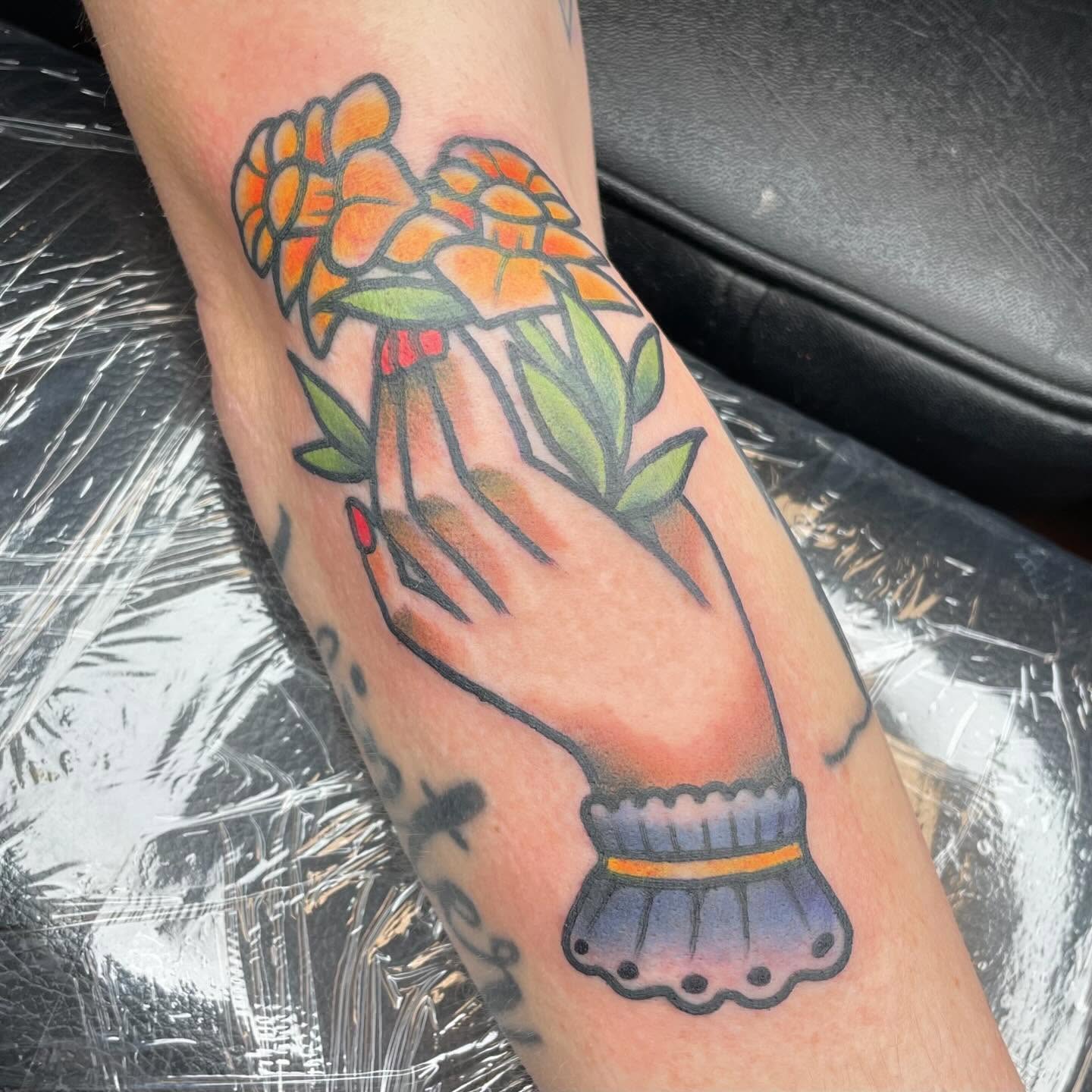 Hand holding flowers American traditional tattoo on the forearm by β¦ πΉπππ π°ππ π·ππππππππ β¦, Nashville, Tennessee
