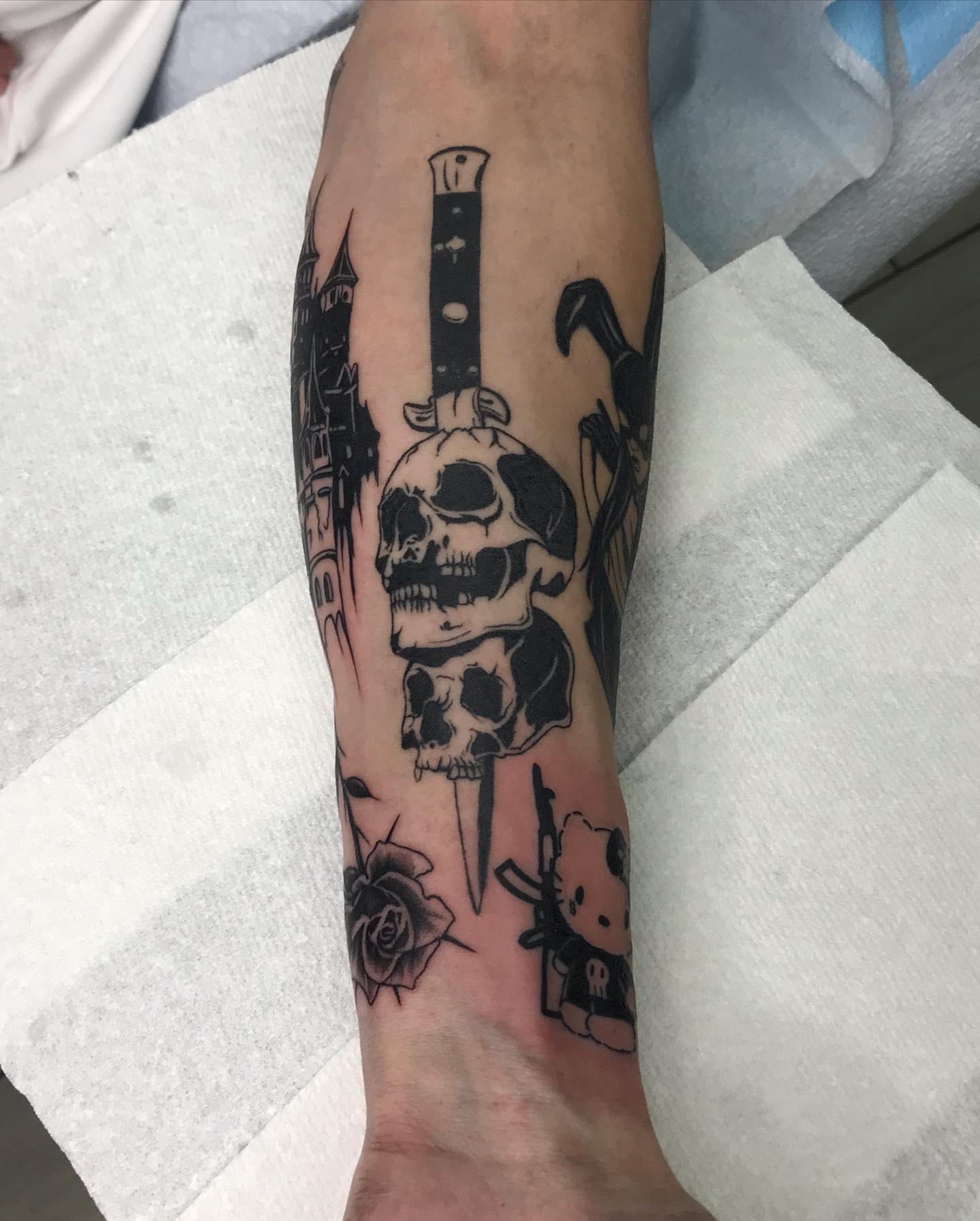 Skulls and dagger black and grey tattoo on the forearm by ✨tiffy ✨
