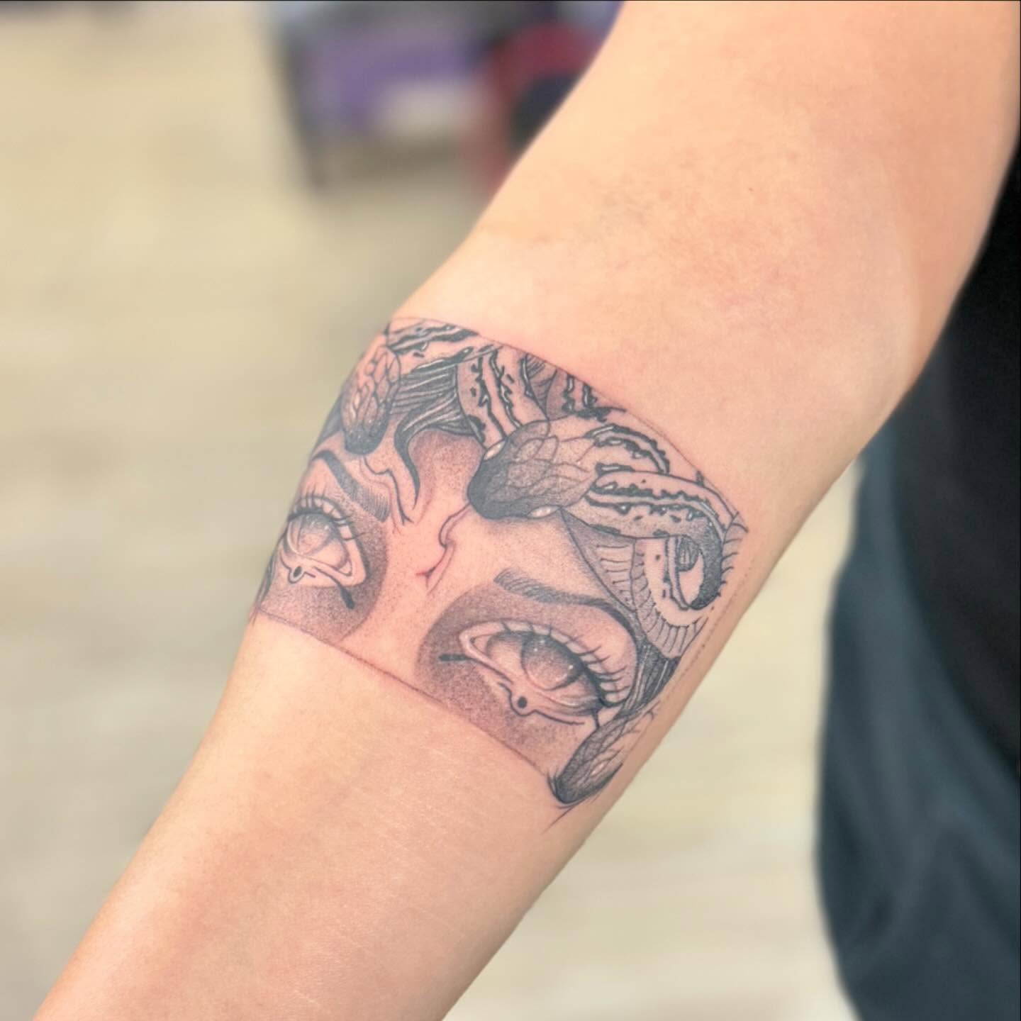 Snake black and grey tattoo on the forearm by Steve