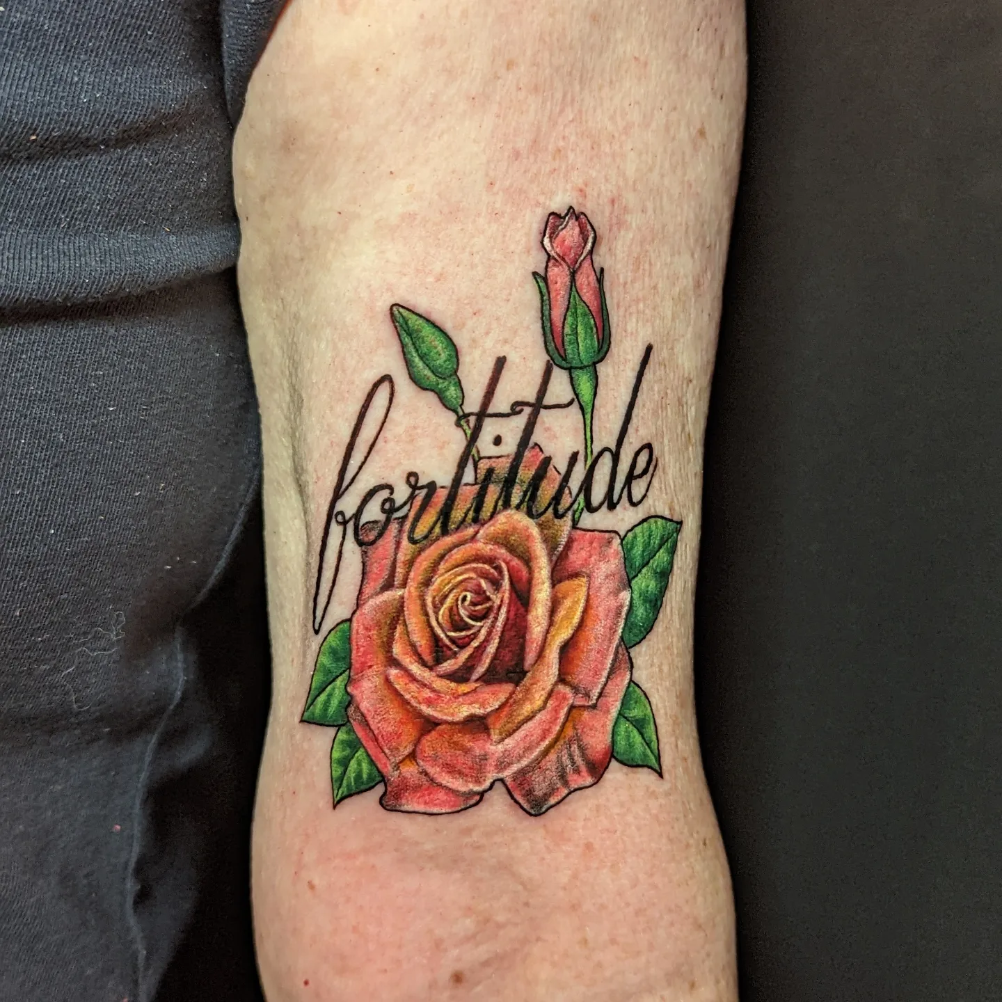 Rose and bud realism tattoo on the forearm by Jay Trip
