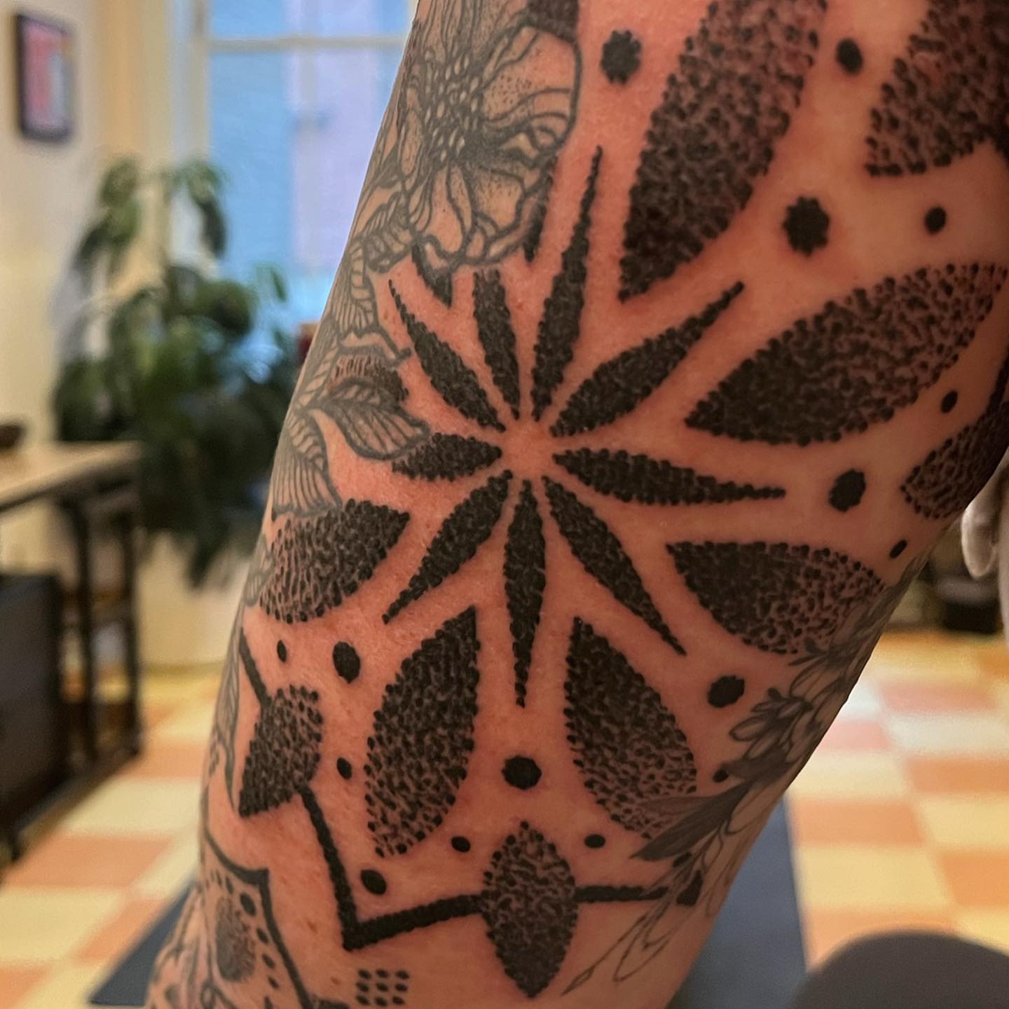 Geometric pattern dotwork tattoo on the forearm by kevvy