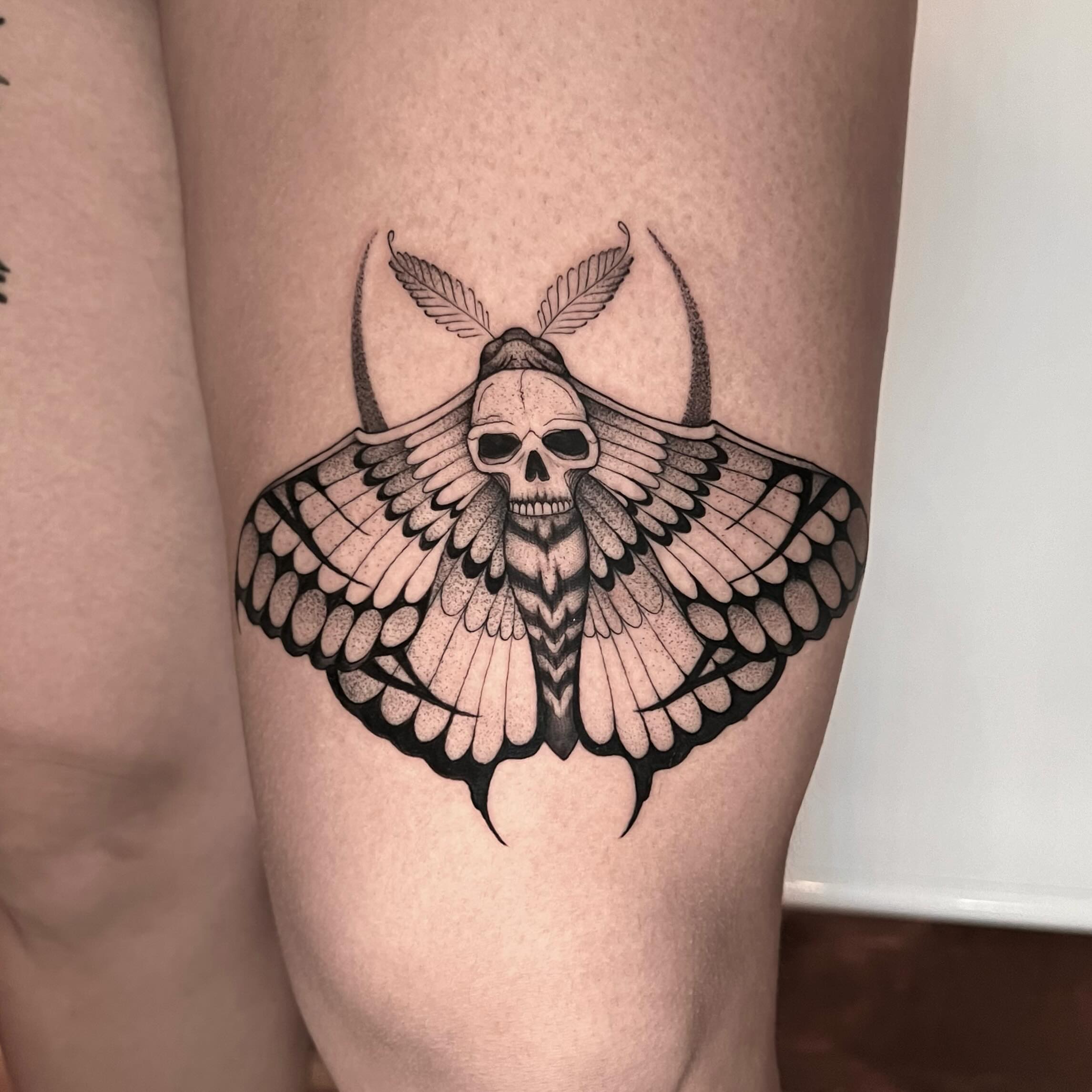 Moth skull black and grey tattoo on the thigh by Chelsea Darling