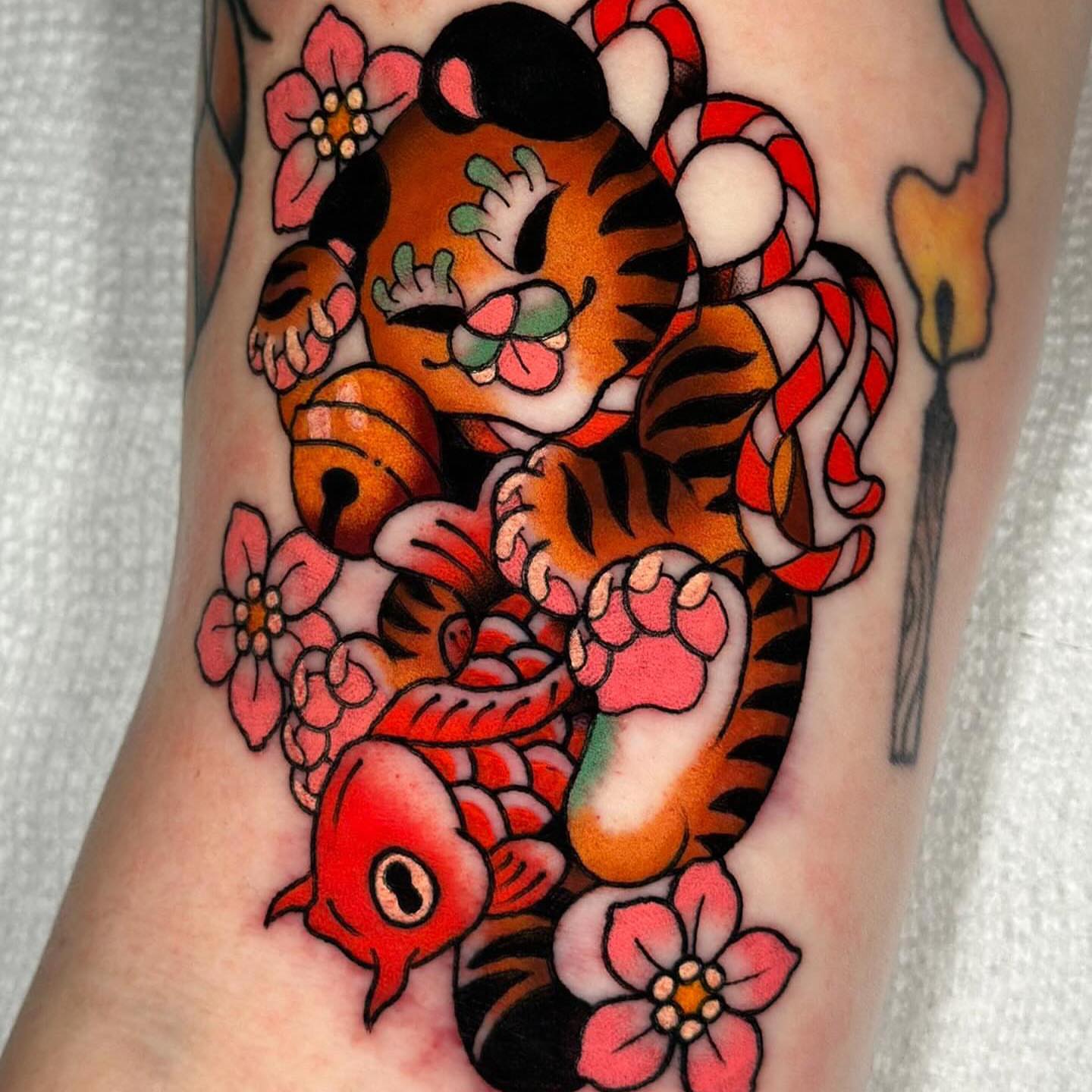 Tiger and candy cane American traditional tattoo on the forearm by π»πππππ πΉπππ