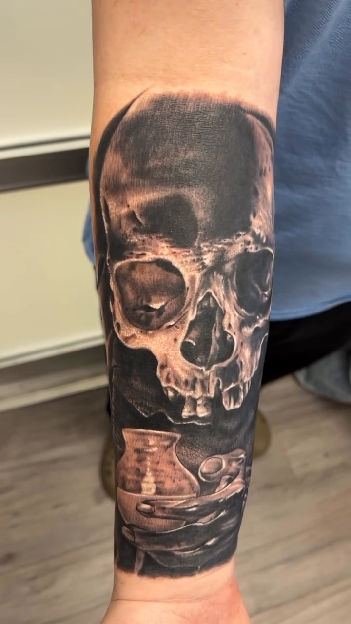 Skull and ship realism tattoo by Krys King Tattoos