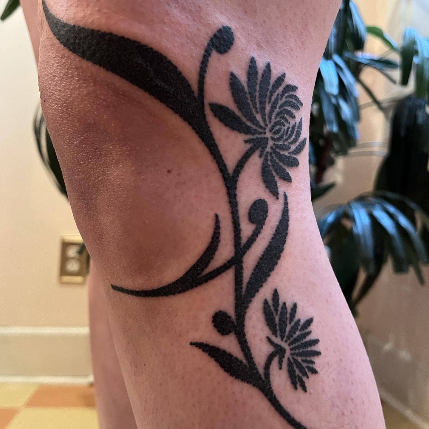 Flower vine black and grey tattoo on the forearm by kevvy