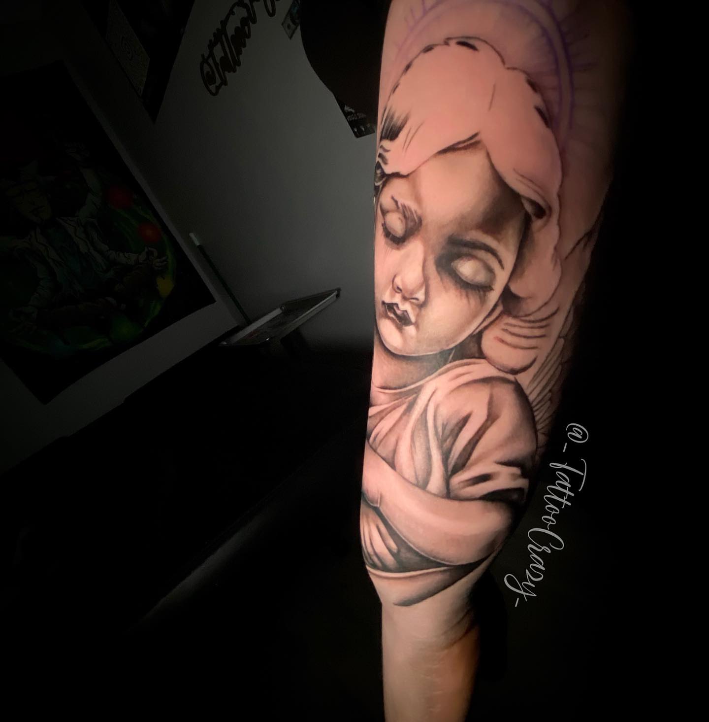 Sleeping child realism tattoo on the forearm by TattooCrazy🎭