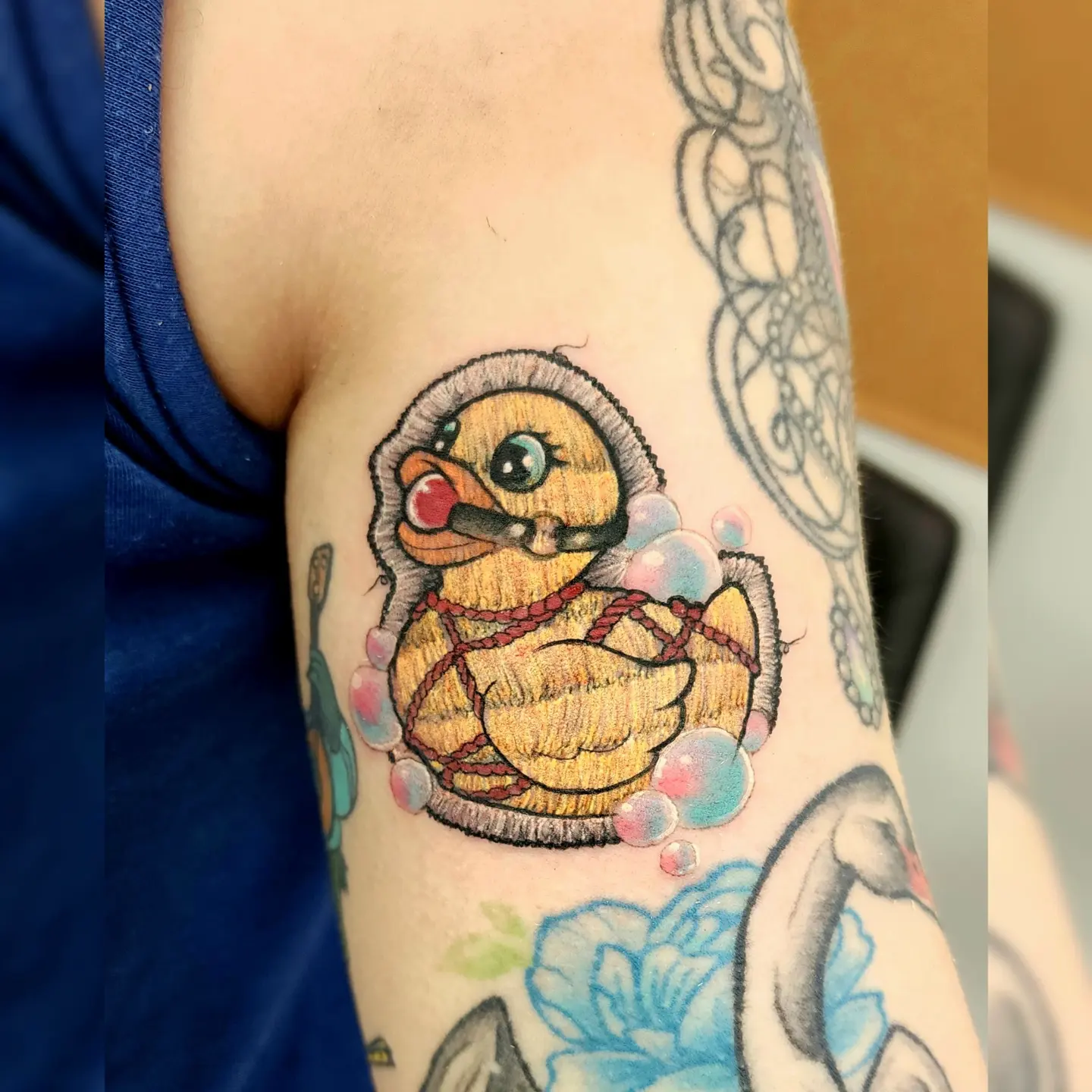 Rubber duck American traditional tattoo on the forearm by Diane Maya