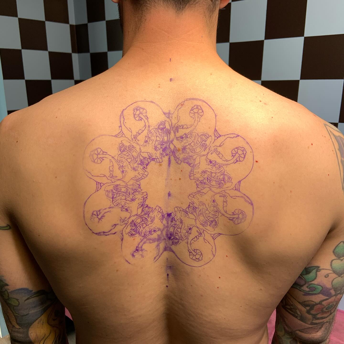 Abstract floral dotwork tattoo on the back by Bombay Pain Co.