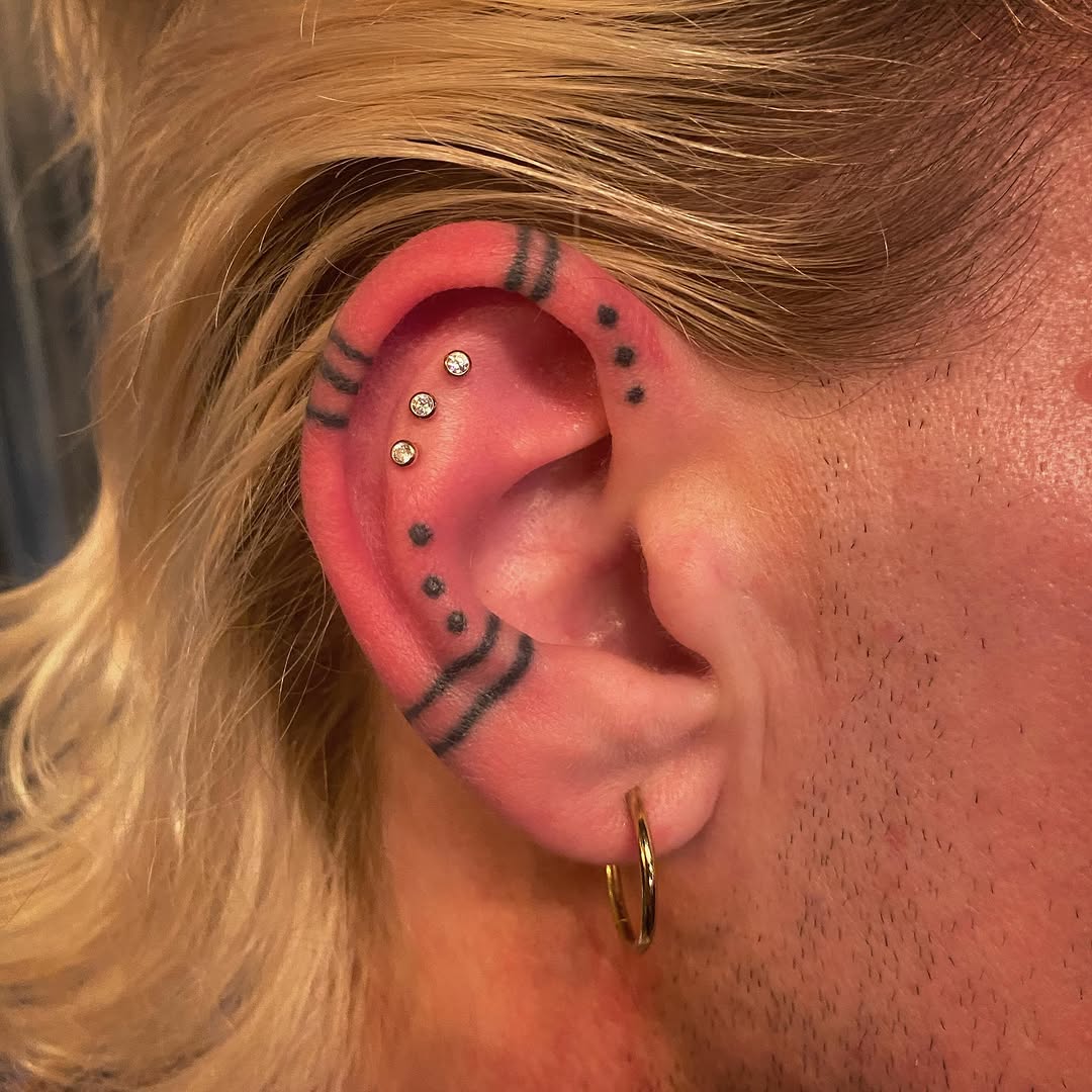 Ear tattoos and piercings dotwork tattoo by Rylan Thorndyke - Tattoo Artist, Las Vegas, Nevada