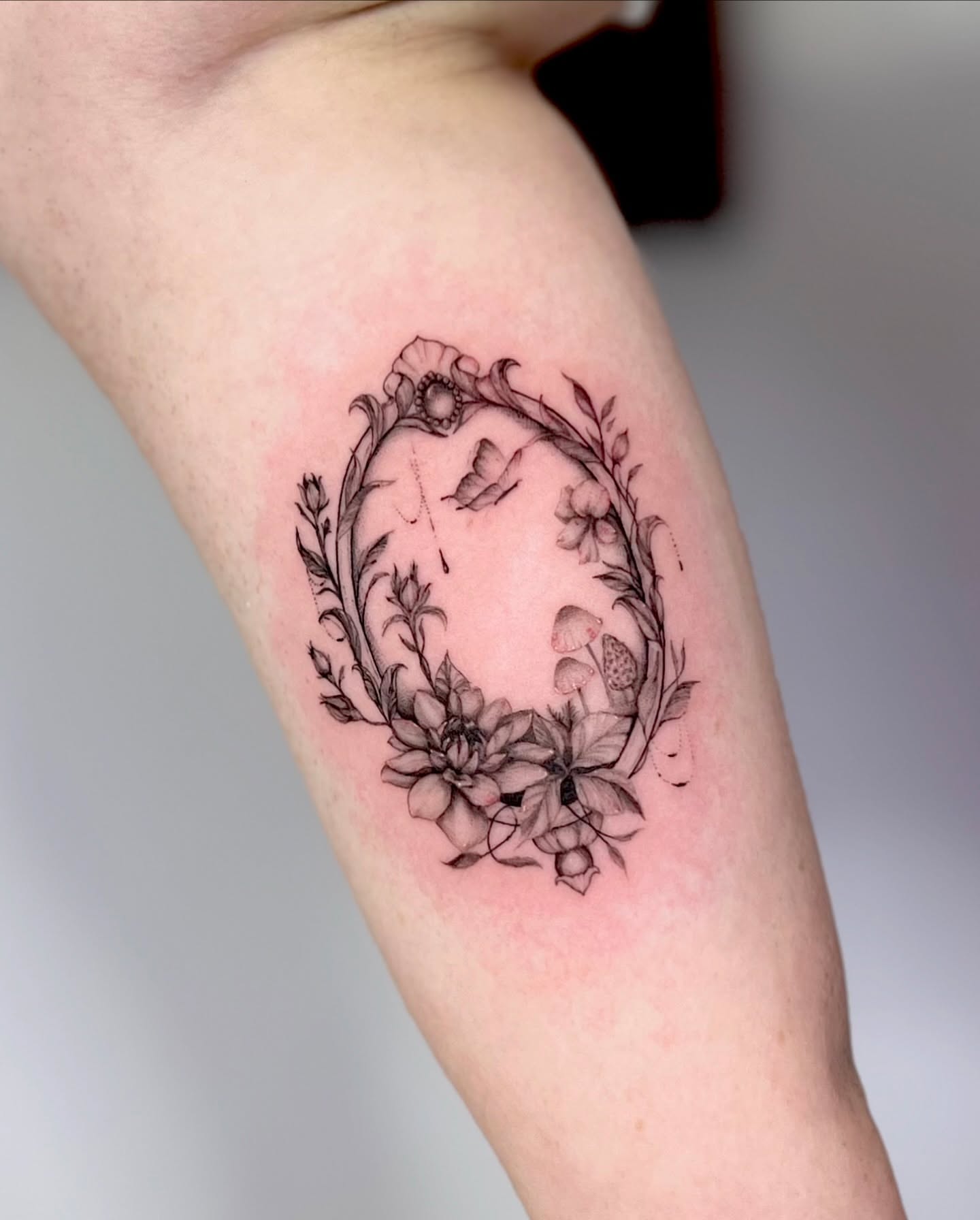 Floral wreath realism tattoo on the forearm by πππ¦