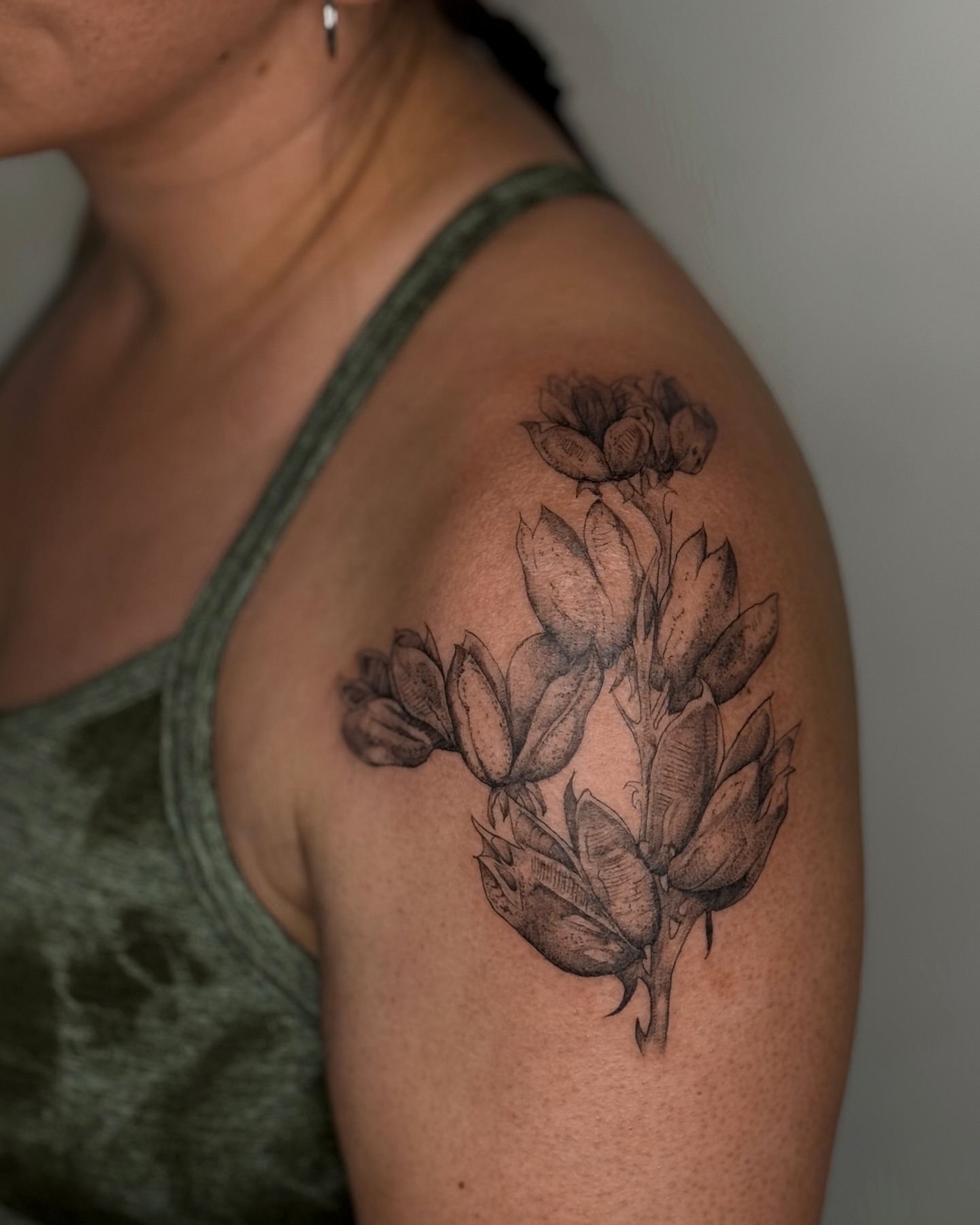 Flower bouquet black and grey tattoo on the shoulder by Dee, San Diego, California