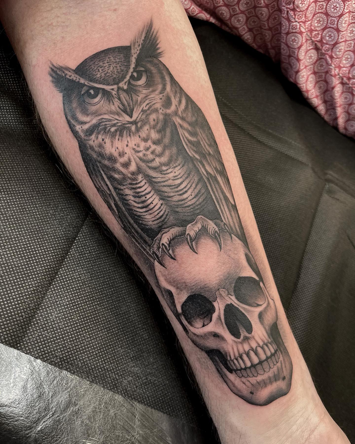 Owl and skull realism tattoo on the forearm by Kelsi Steffensen