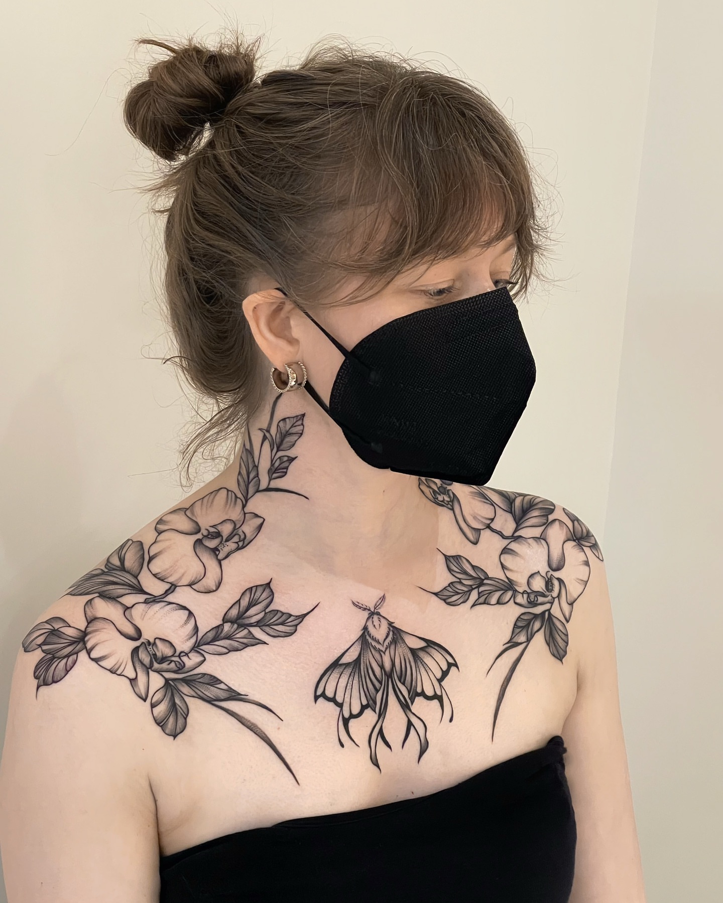 Flowers and moth black and grey tattoo on the shoulder by Seattle Tattoo Artist PingPing, Seattle, Washington