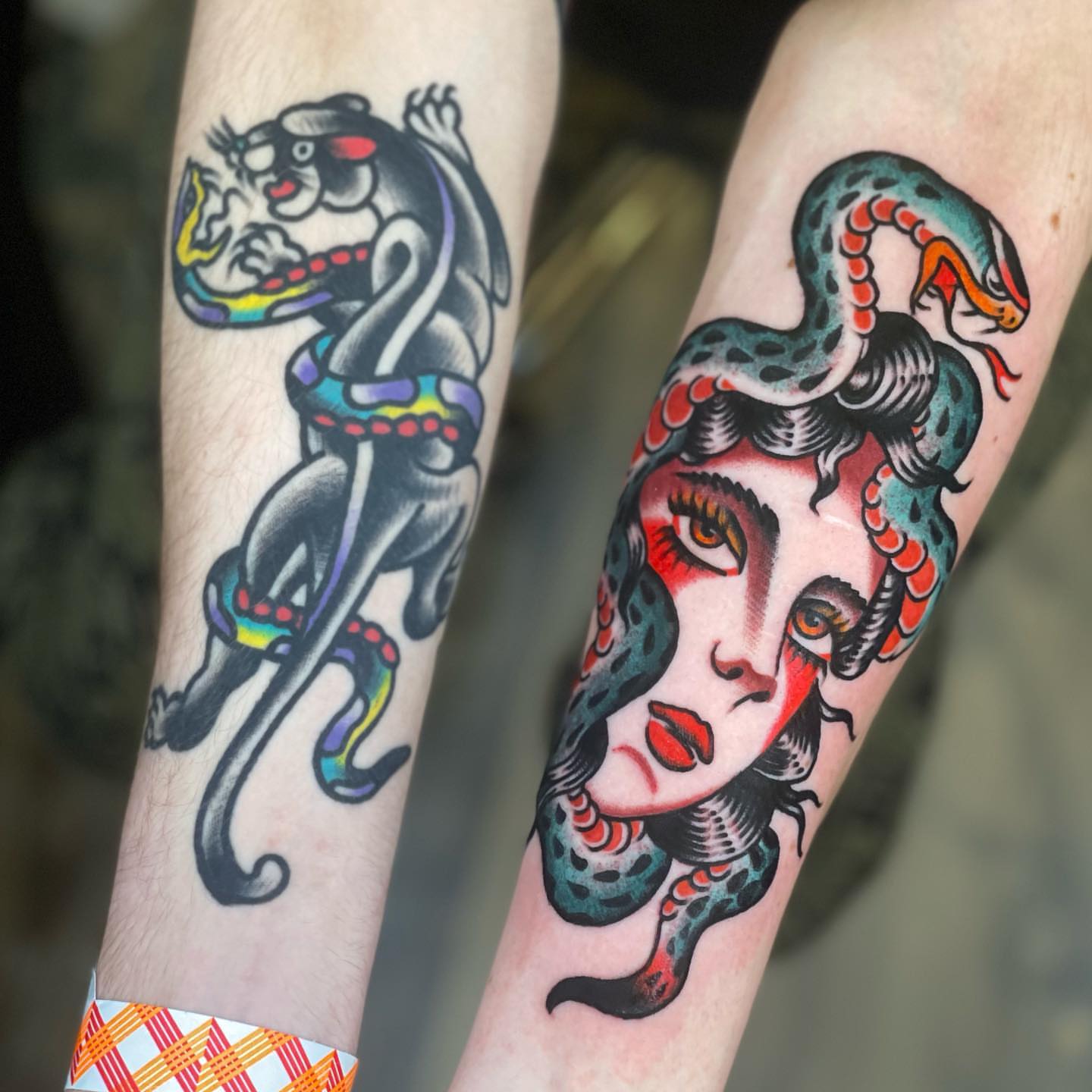 Woman with snake American traditional tattoo on the forearm by Jeff Miller philly traditional tattoo