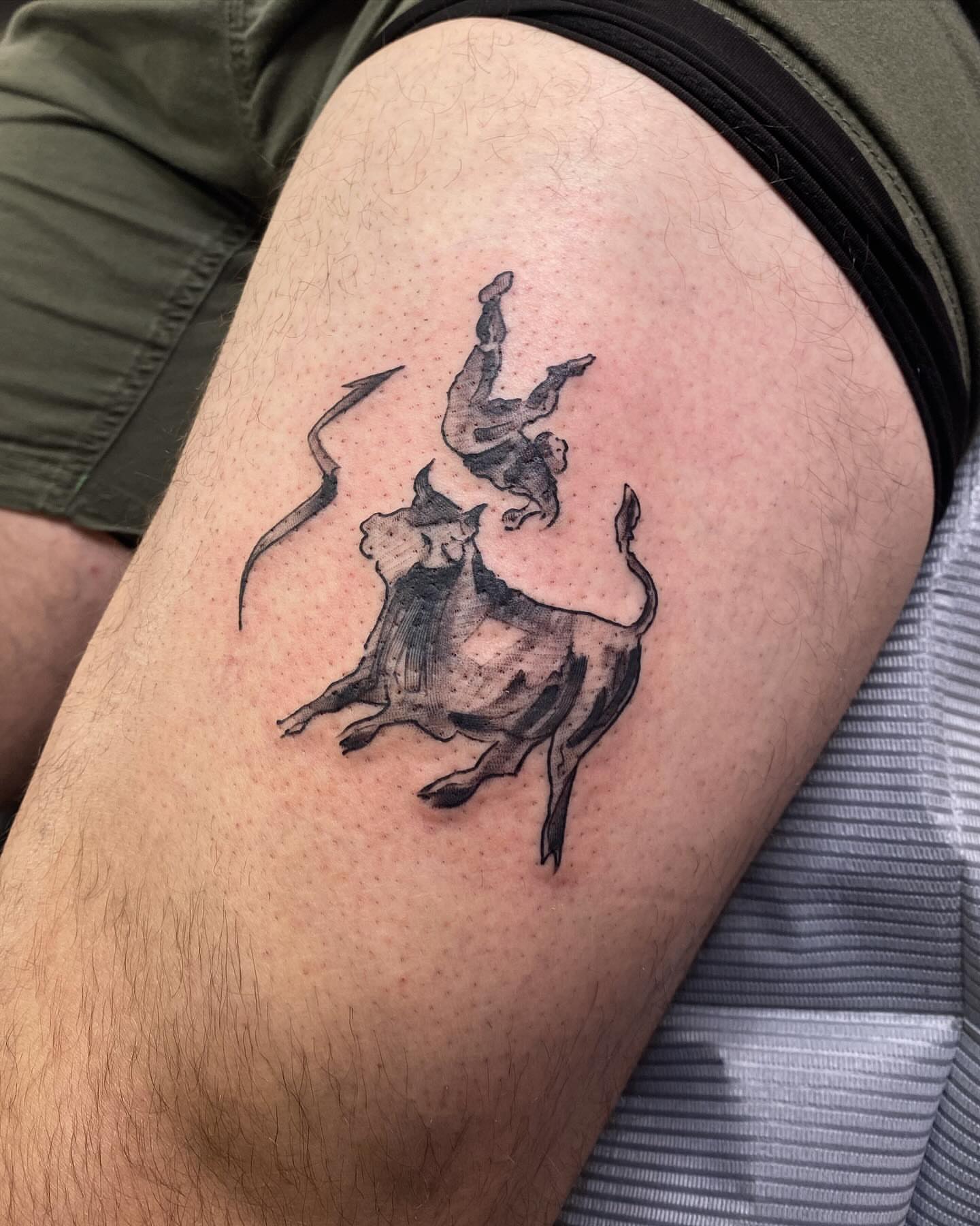 Bull and rider black and grey tattoo on the thigh by @kaitlin.tattoos, Richmond, Virginia