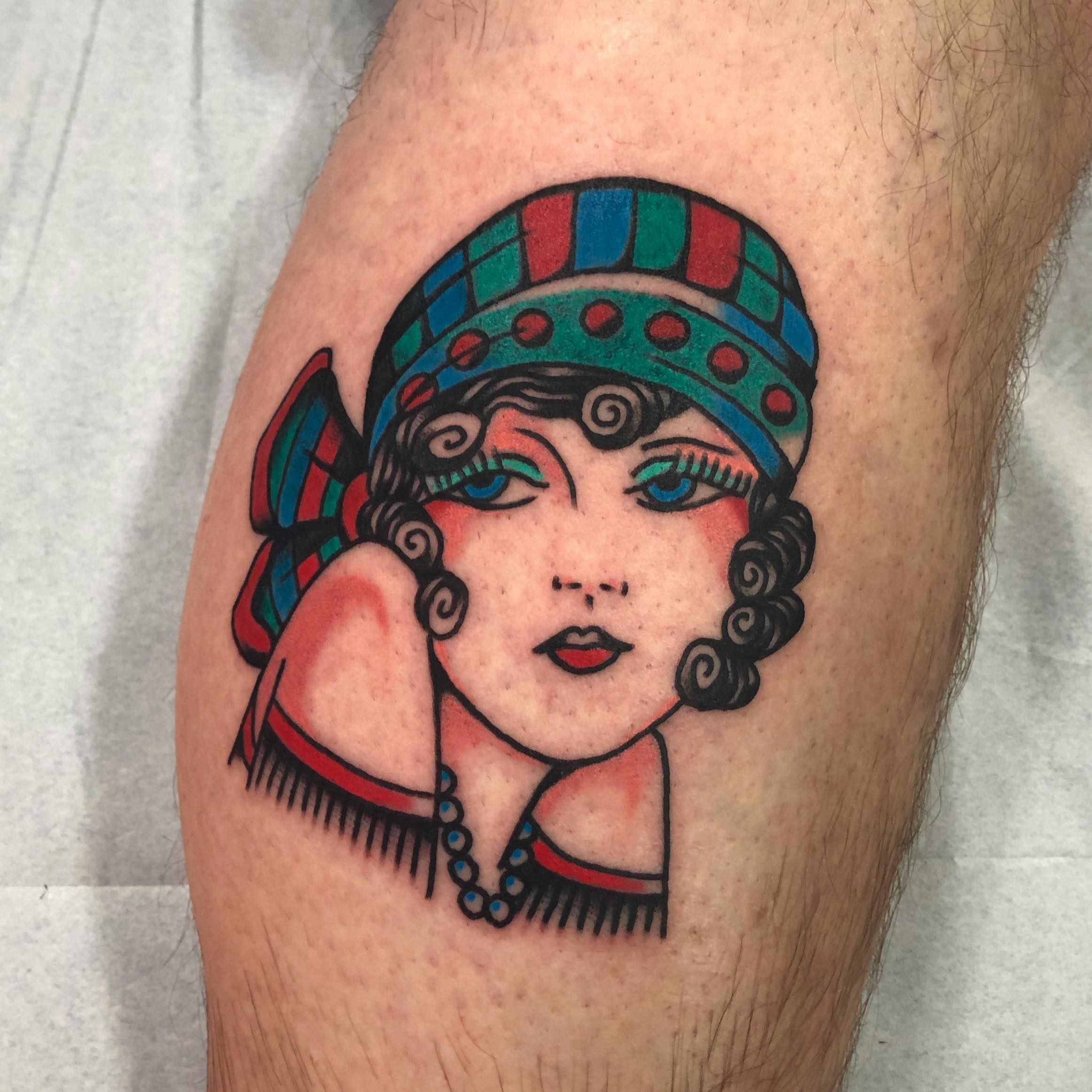 Flapper girl American traditional tattoo on the thigh by brenden