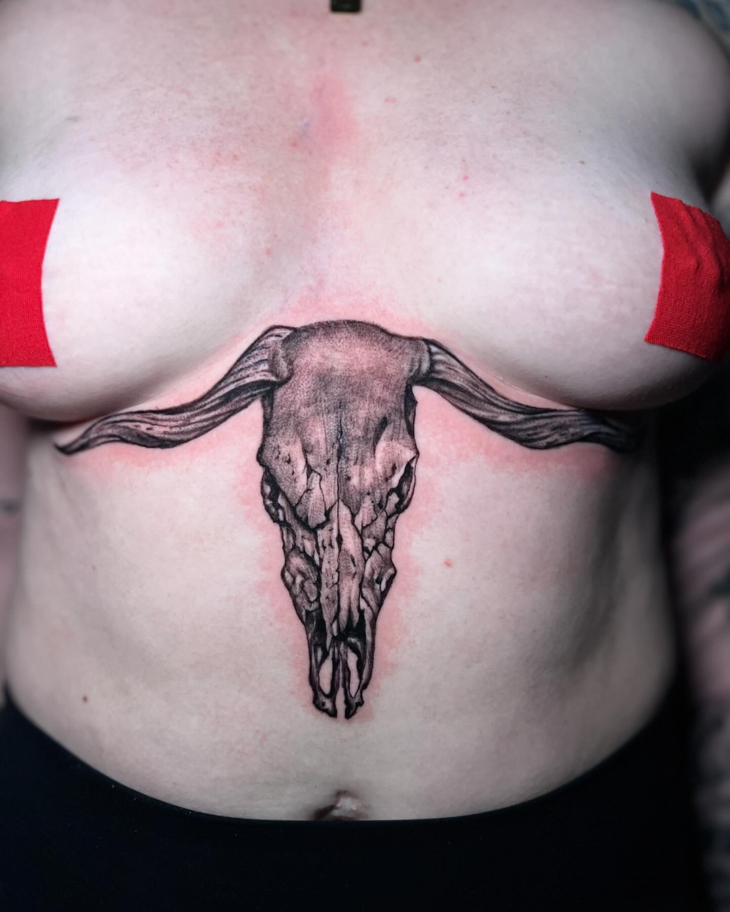 Bull skull black and grey tattoo on the chest by Lucky Valenzuela, Lakewood, Colorado