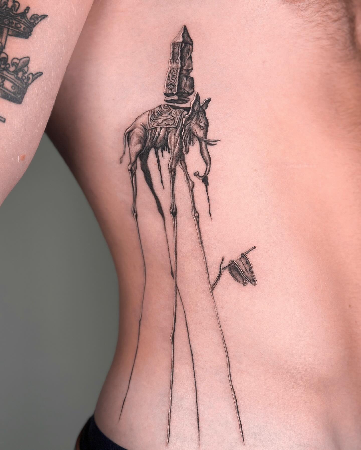 Donkey with rocket surrealism tattoo on the ribs by Valery Cardona