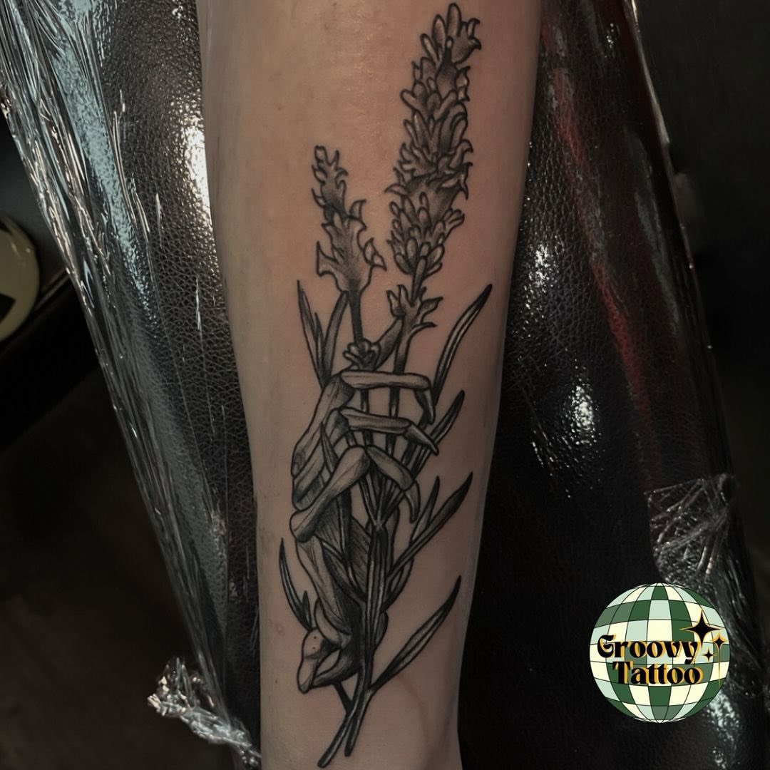 Plant black and grey tattoo on the forearm by Syd Cheyenne