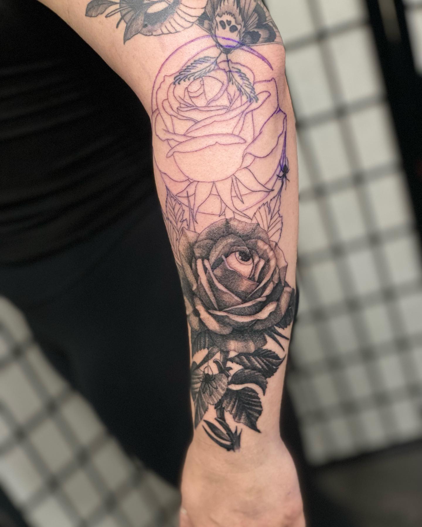 Roses realism tattoo on the forearm by Myth & Mercy Tattoo Co.