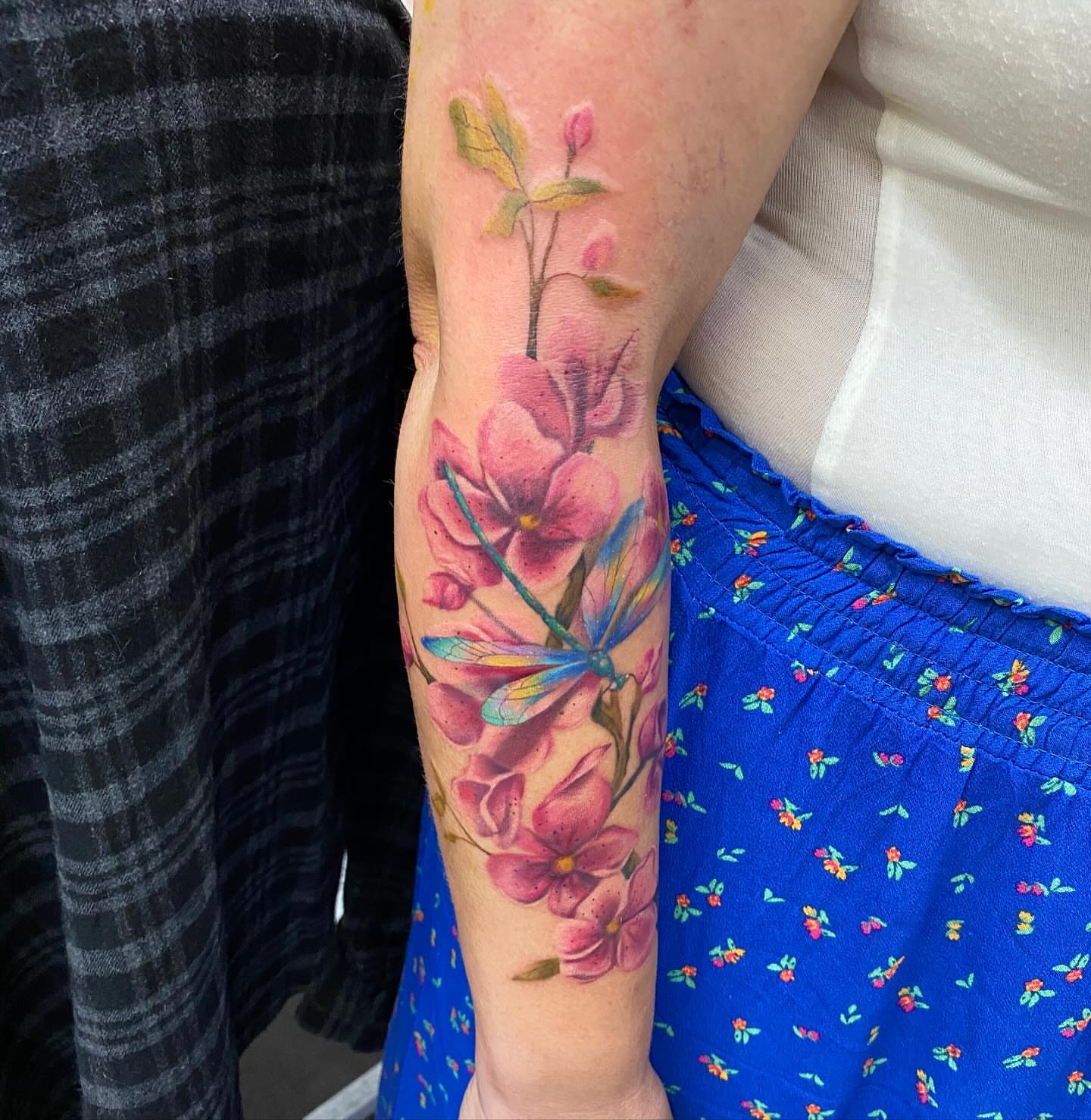 Cherry blossoms and dragonfly realism tattoo on the forearm by James Howell