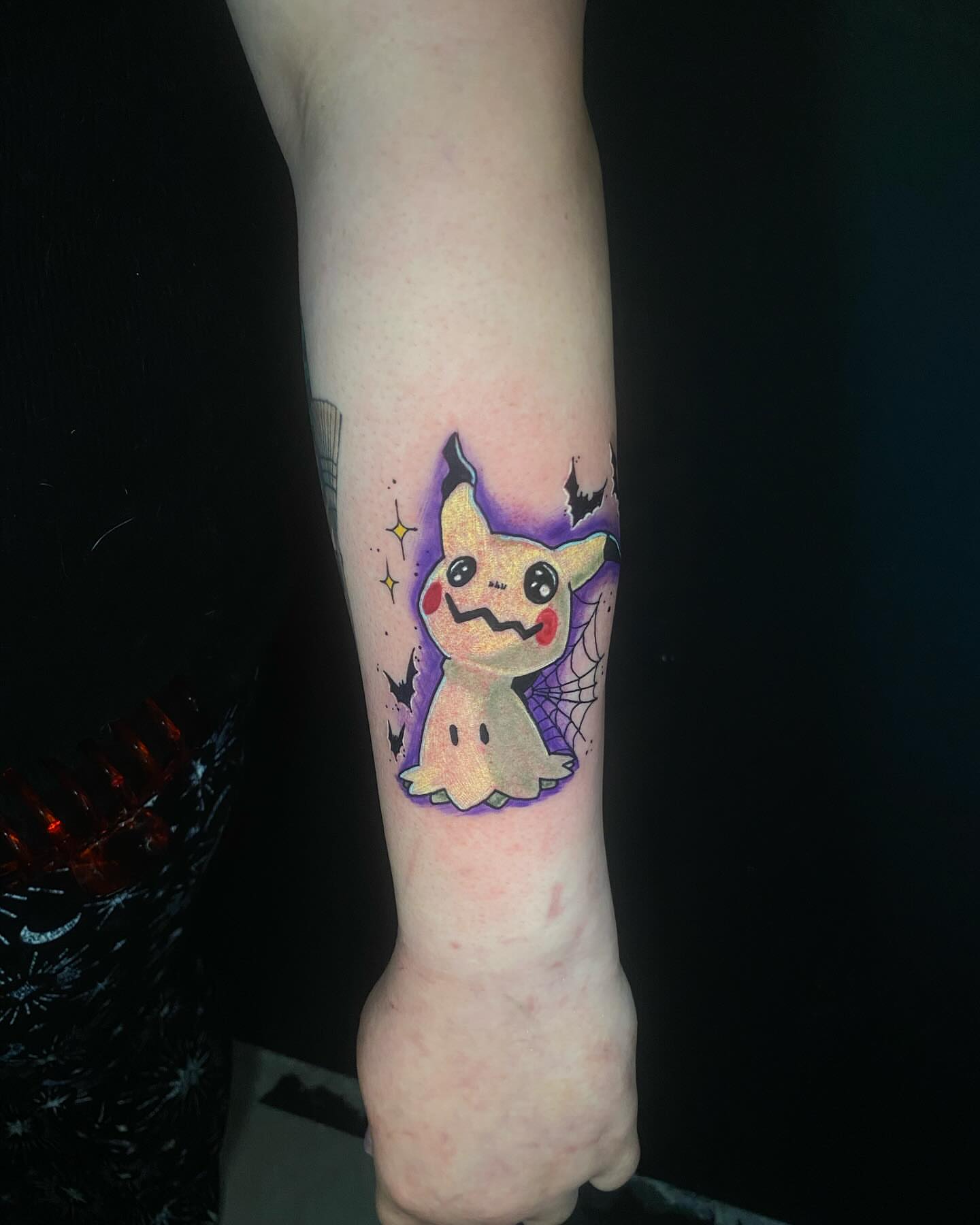 Ghost Pikachu dotwork tattoo on the forearm by Glen Wallis