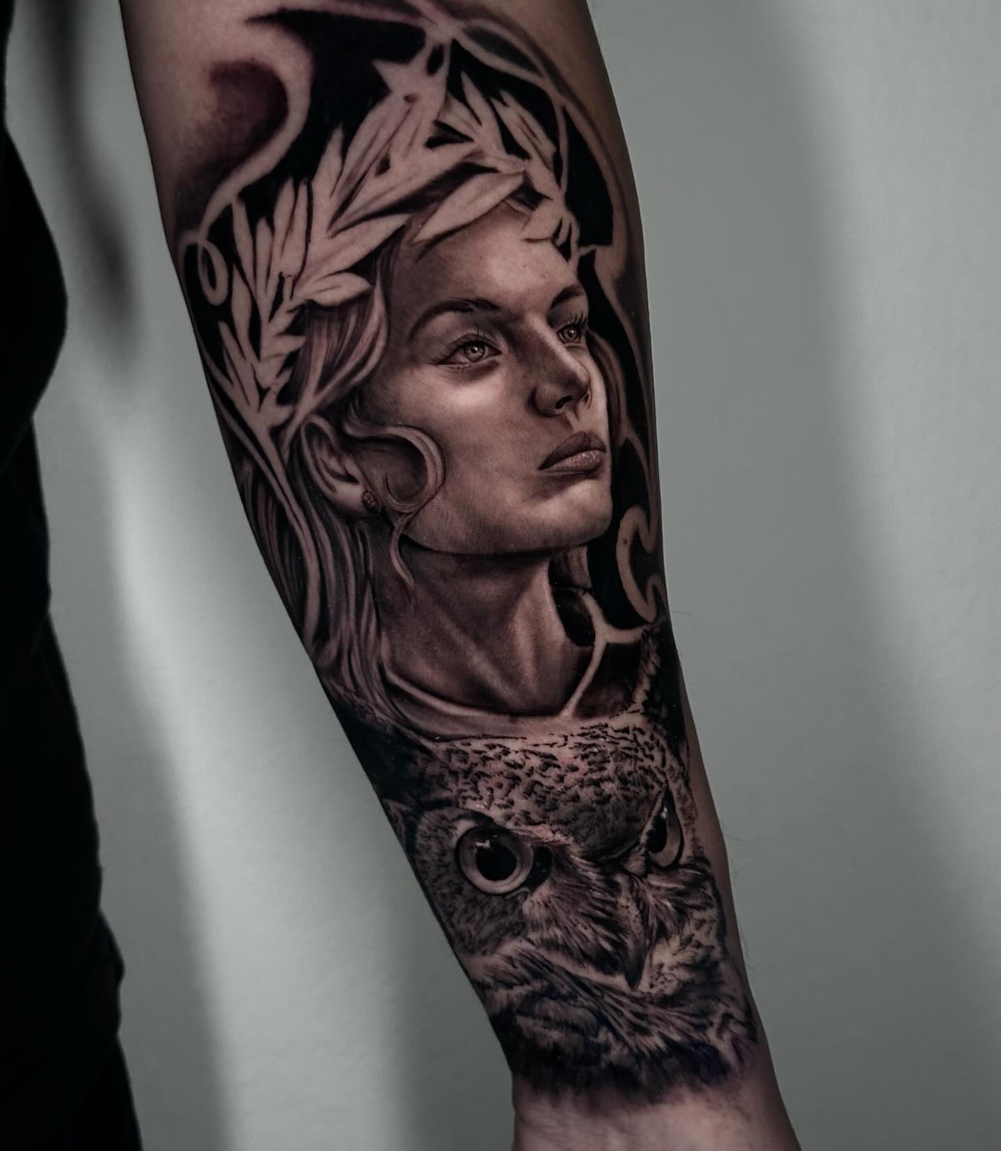 Woman with owl realism tattoo on the forearm by Diego Aravena