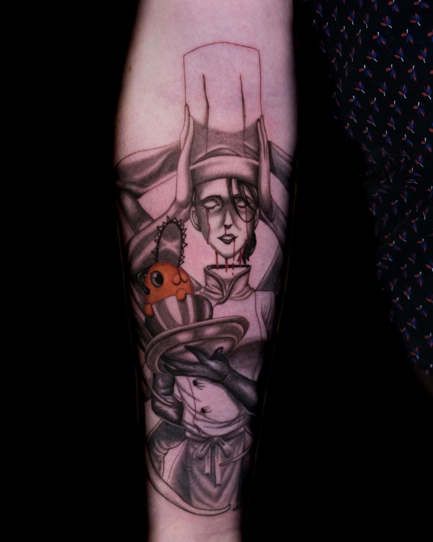 Chef with chainsaw dark realism tattoo on the forearm by Tattoo Artist