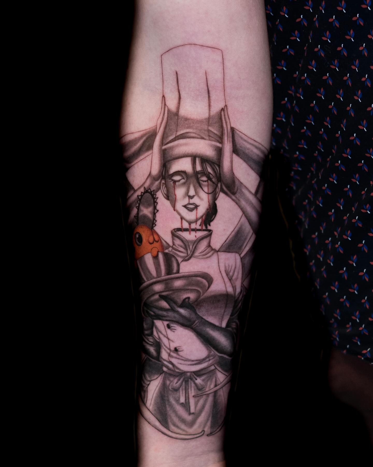 Woman with chef hat dark realism tattoo on the forearm by Tattoo Artist