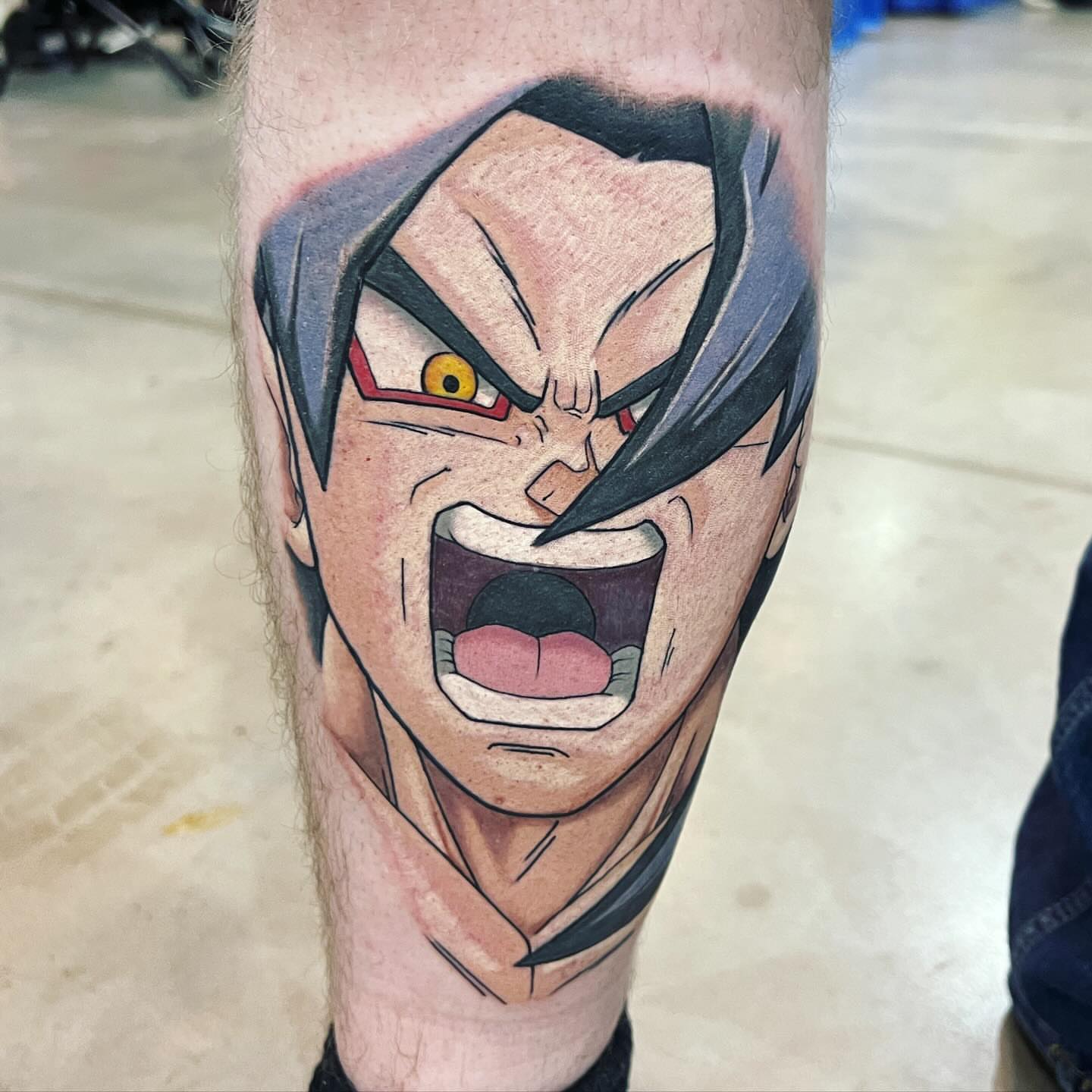 Angry character anime tattoo on the forearm by Bryon McVaney