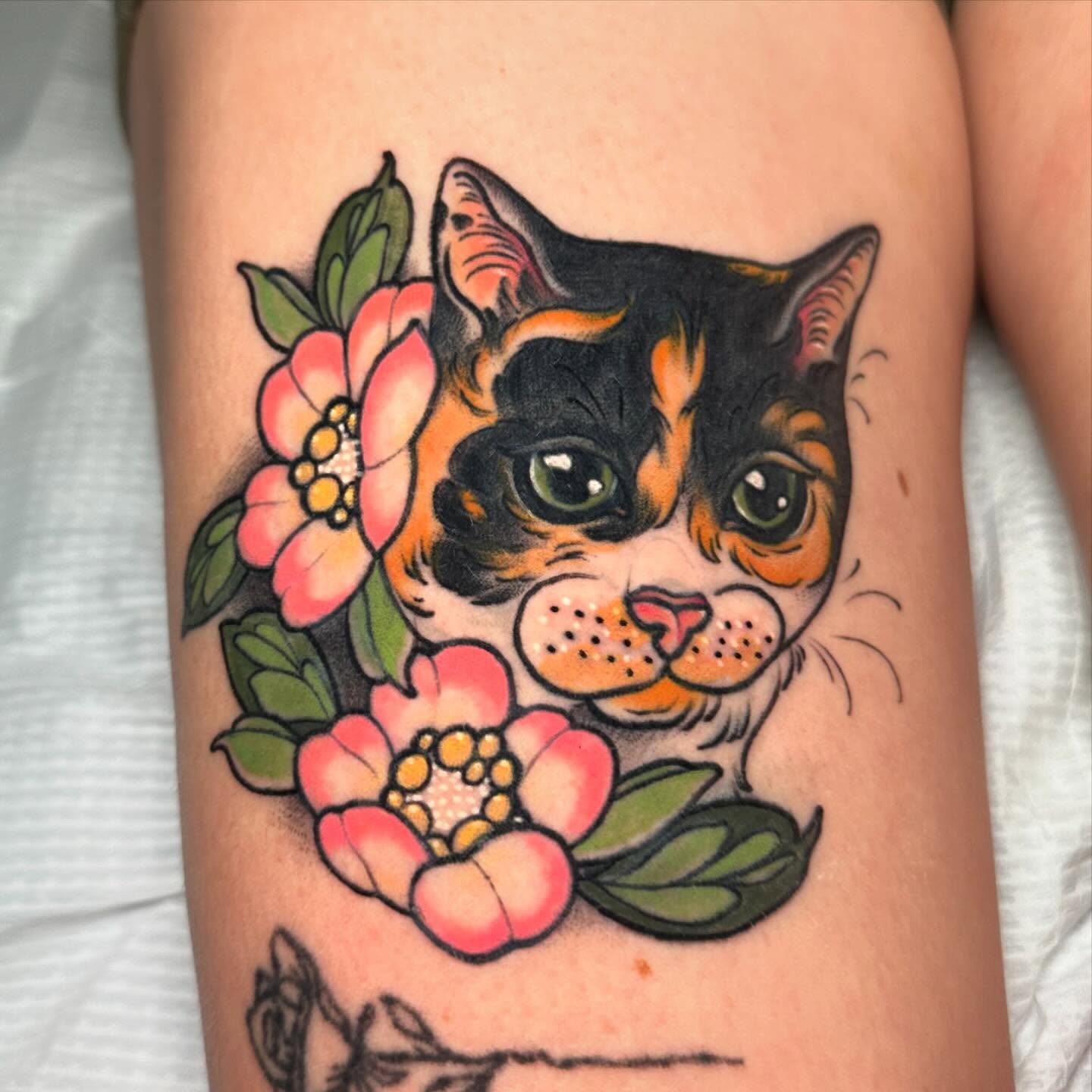 Calico cat with flowers American traditional tattoo on the forearm by Tayler Pearson, Fort Collins, Colorado
