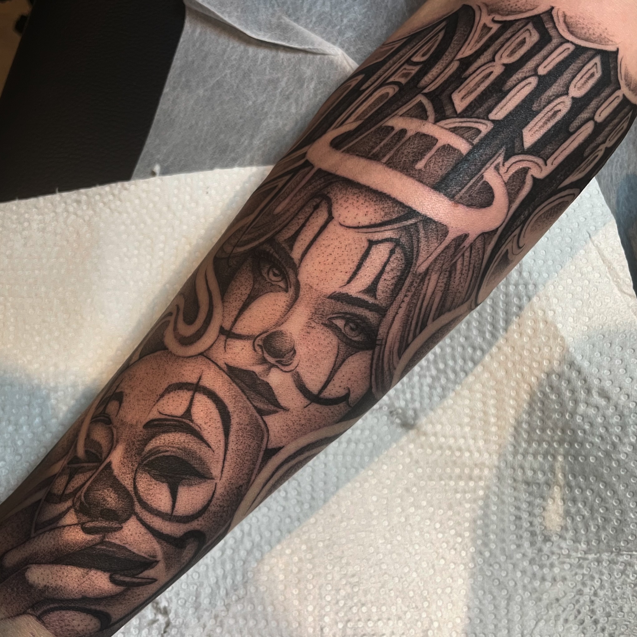 Woman's face dotwork tattoo on the forearm by Chicanocustomlettering