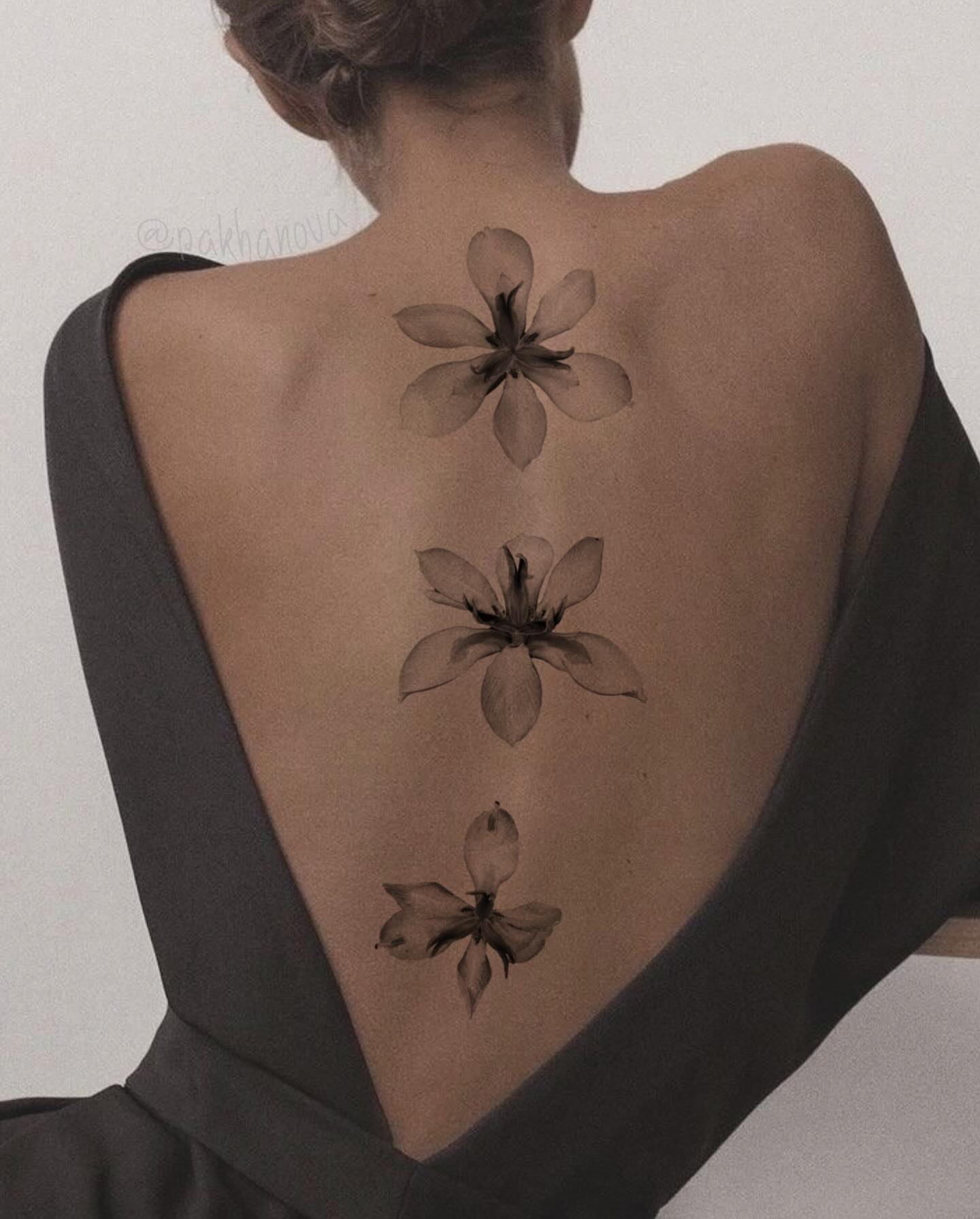 Flowers black and grey tattoo on the back by Anastasiia Pakhanova ♥ tattoo artist
