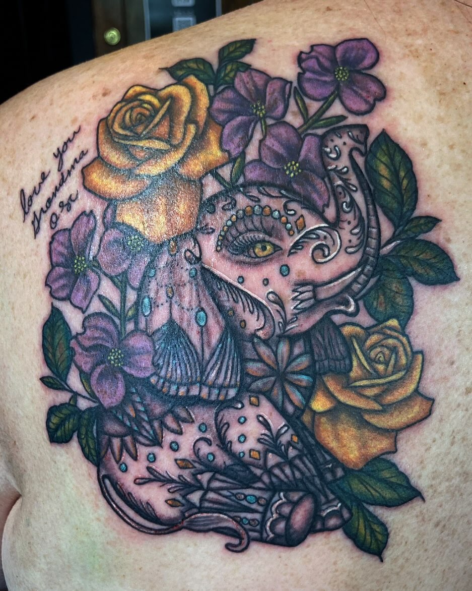 Sugar skull surrounded by flowers dotwork tattoo on the shoulder by Madeline, Akron, Ohio