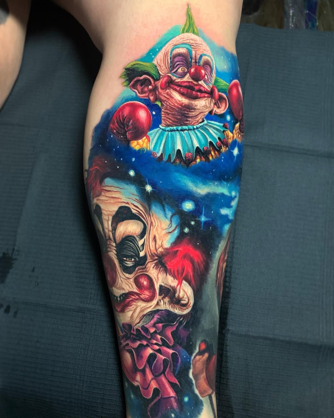 Two creepy clowns in space realism tattoo on the forearm by 🦇𝖀𝖙𝖆𝖍🦇, Las Vegas, Nevada
