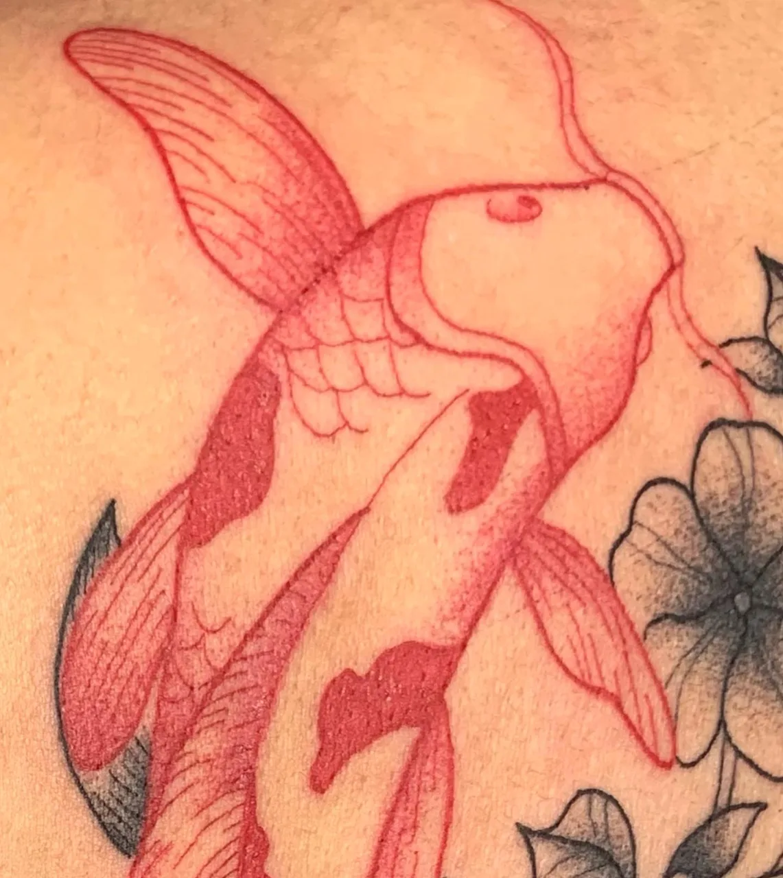 Koi fish dotwork tattoo on the upper arm by Savana ☆