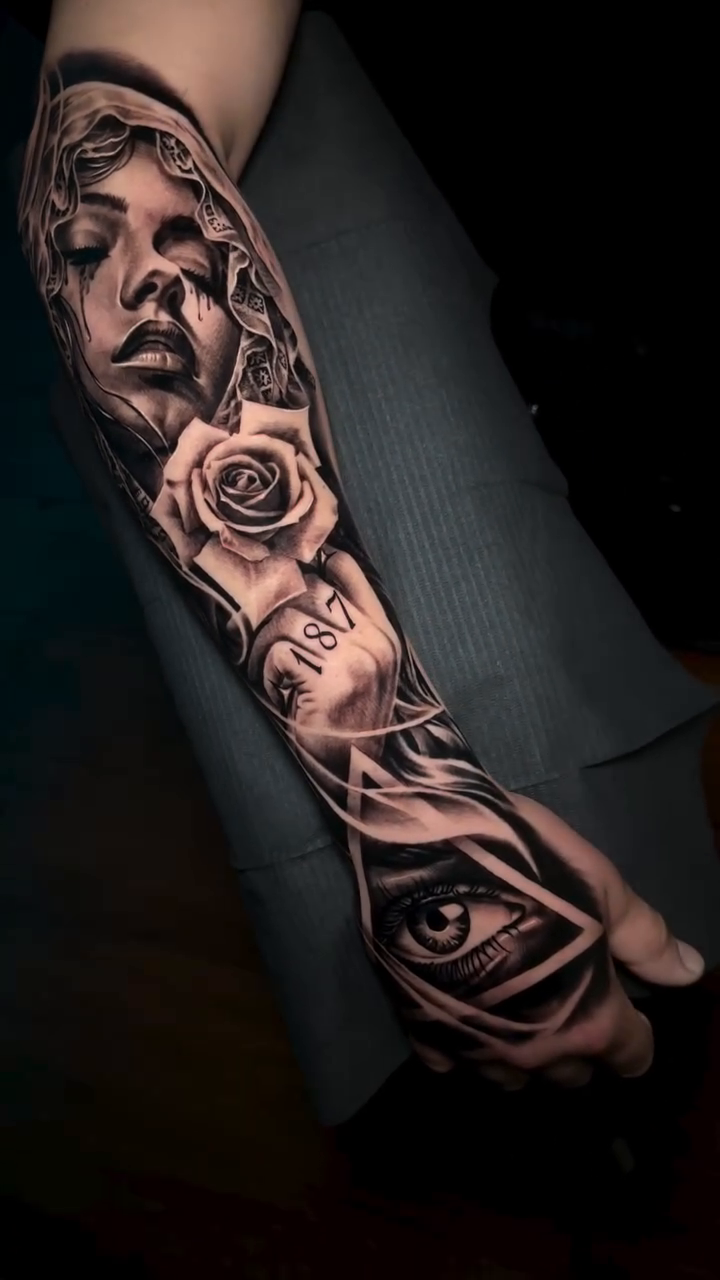 Woman, roses, eye realism tattoo by 𝐉𝐨𝐧 𝐒𝐚𝐧𝐭𝐨𝐬