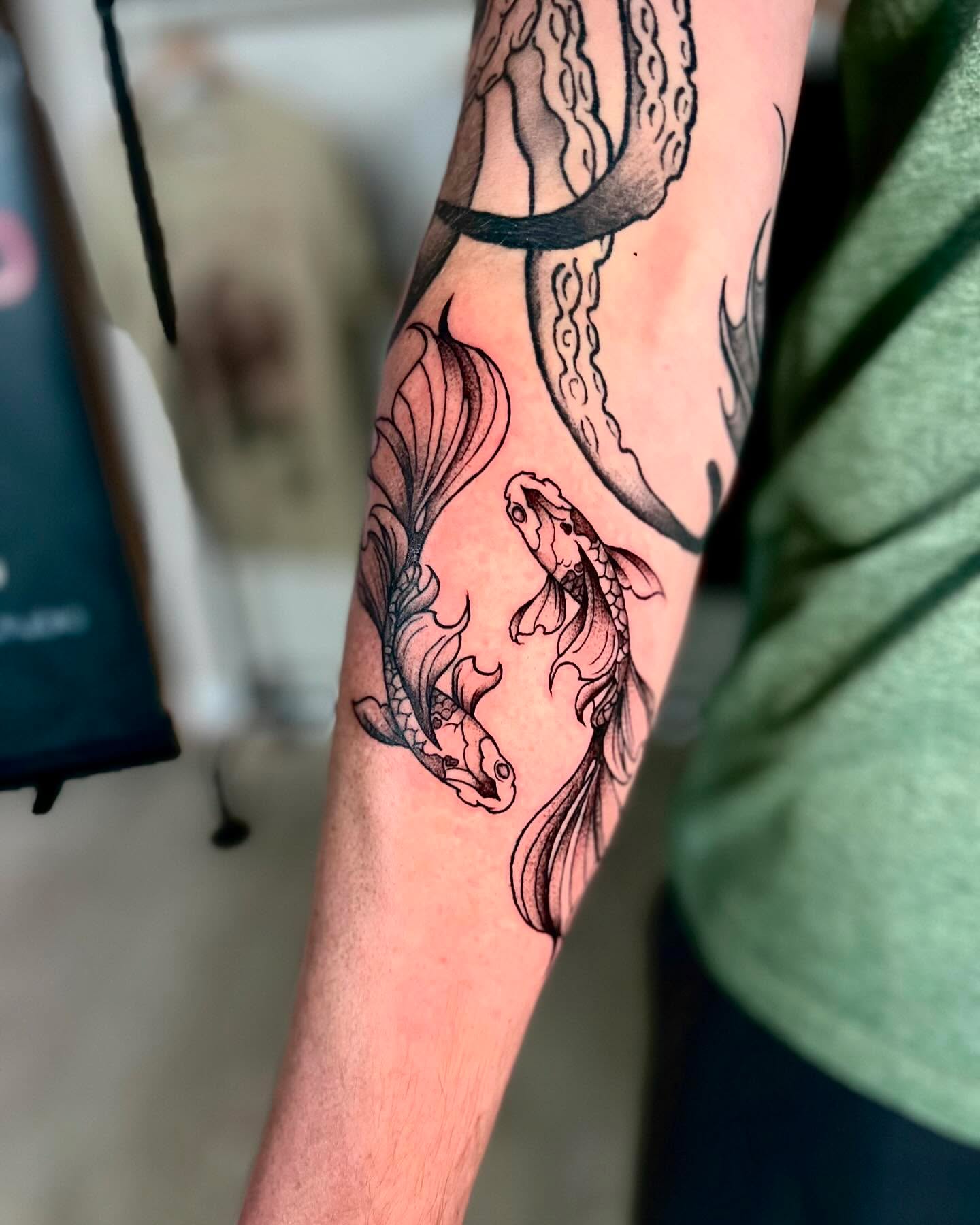 Koi fish black and grey tattoo on the forearm by Ashley Fino, Las Vegas, Nevada