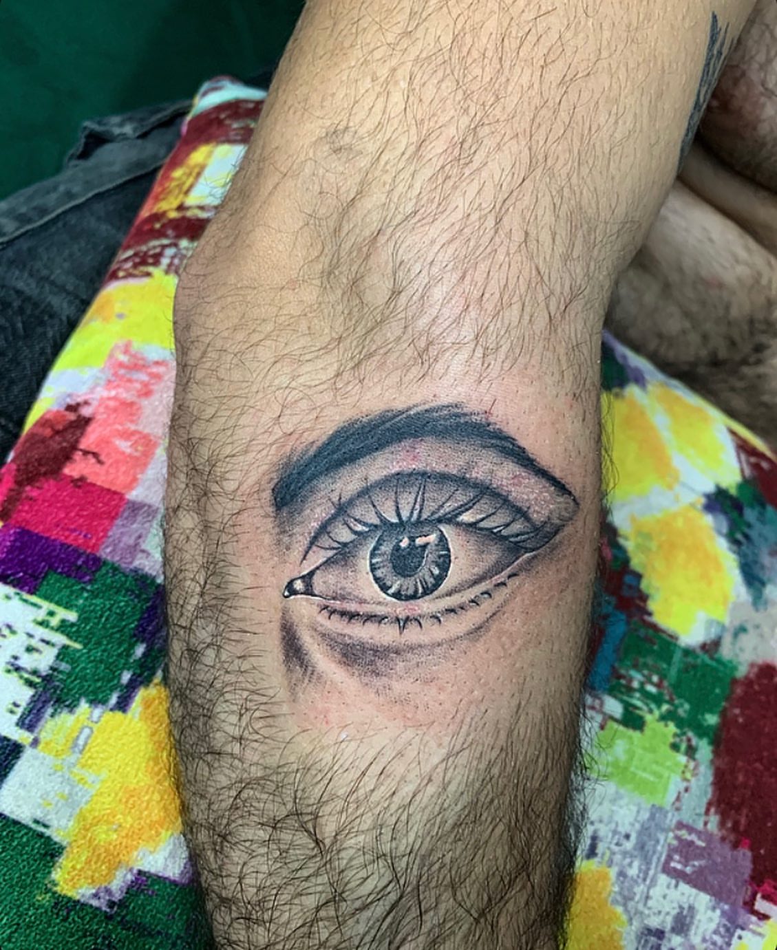 Eye realism tattoo on the forearm by la flamme